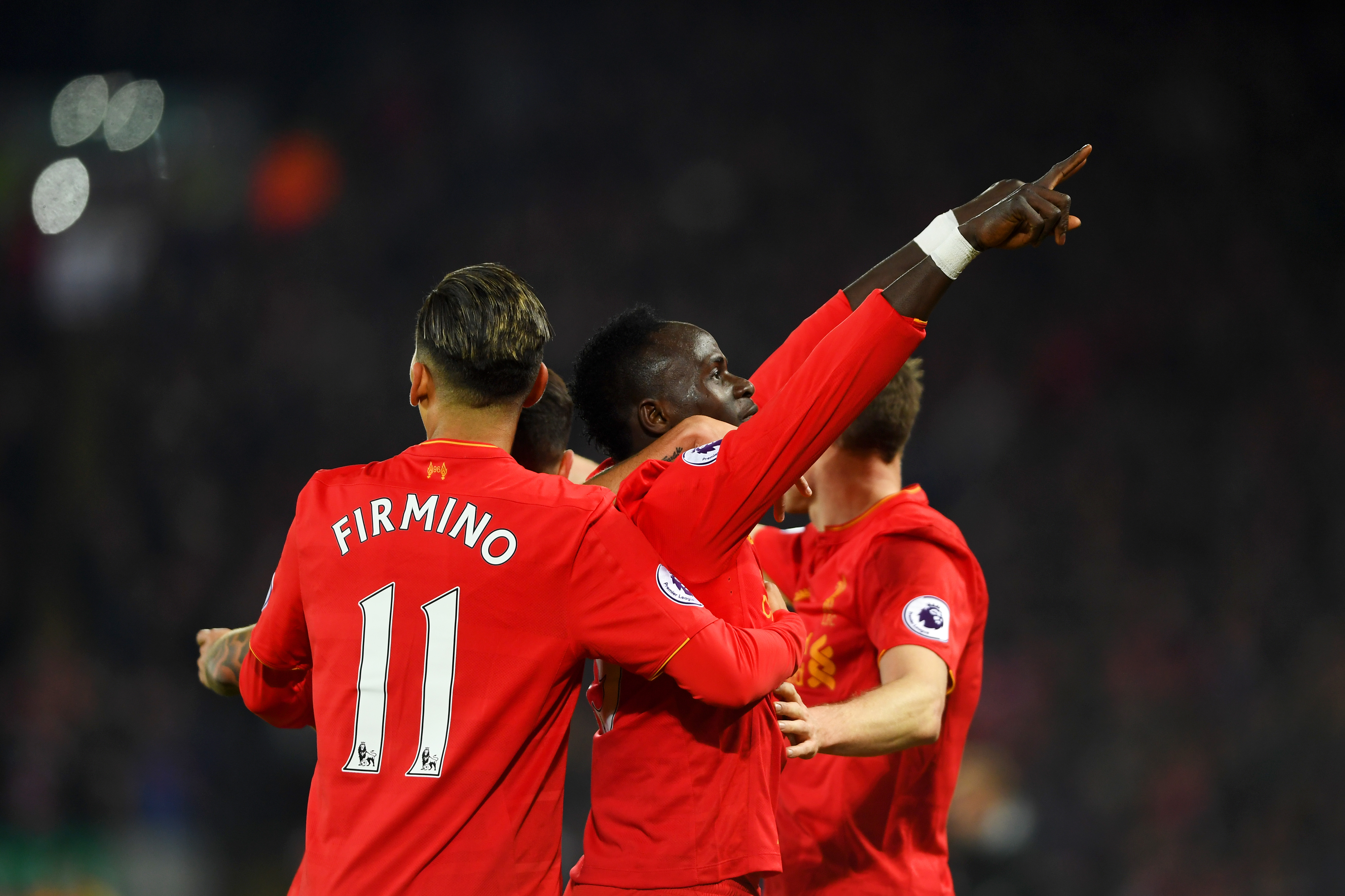 LIVERPOOL, ENGLAND - FEBRUARY 11: Sadio Mane (C) of Liverpool celebrates scoring the oprning goal with his team mates during the Premier League match between Liverpool and Tottenham Hotspur at Anfield on February 11, 2017 in Liverpool, England.  (Photo by Mike Hewitt/Getty Images for Tottenham Hotspur FC)