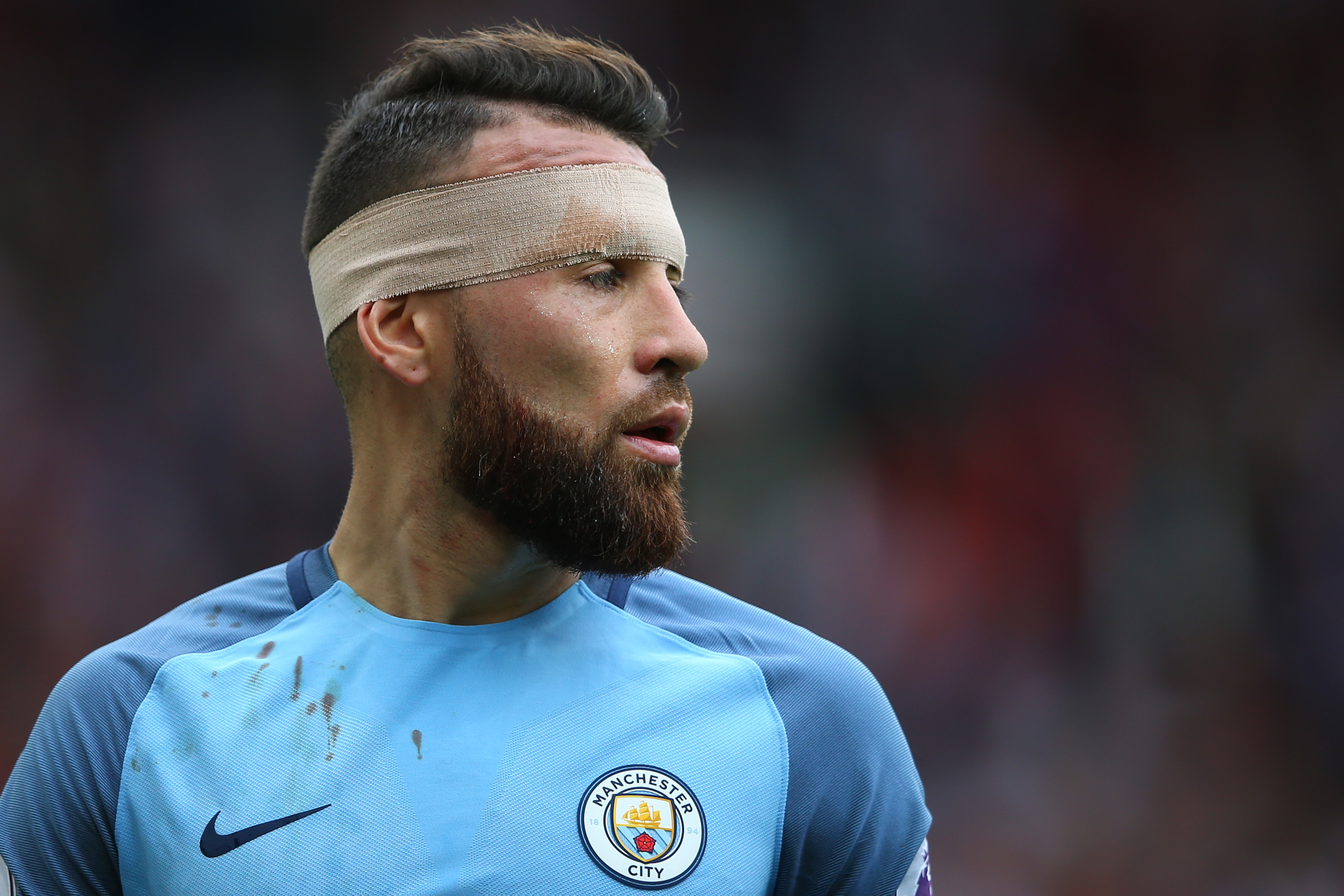 MANCHESTER, ENGLAND - SEPTEMBER 10:  Nicolas Otamendi of Manchester City wears a bandage during the Premier League match between Manchester United and Manchester City at Old Trafford on September 10, 2016 in Manchester, England.  (Photo by Alex Livesey/Getty Images)