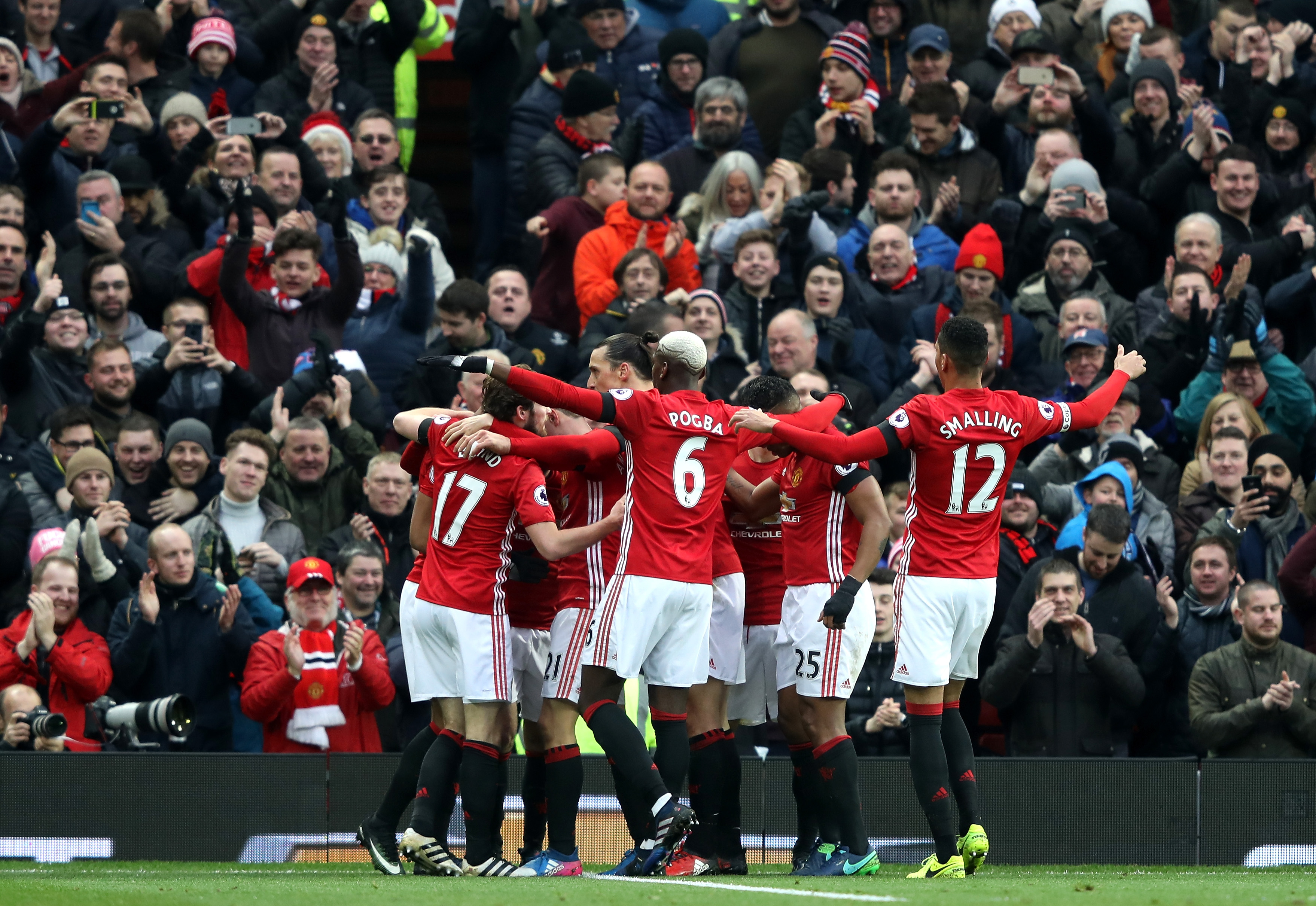 MANCHESTER, ENGLAND - FEBRUARY 11: Manchester United players celebrate their first goal by Juan Mata (obscured) during the Premier League match between Manchester United and Watford at Old Trafford on February 11, 2017 in Manchester, England.  (Photo by Mark Thompson/Getty Images)