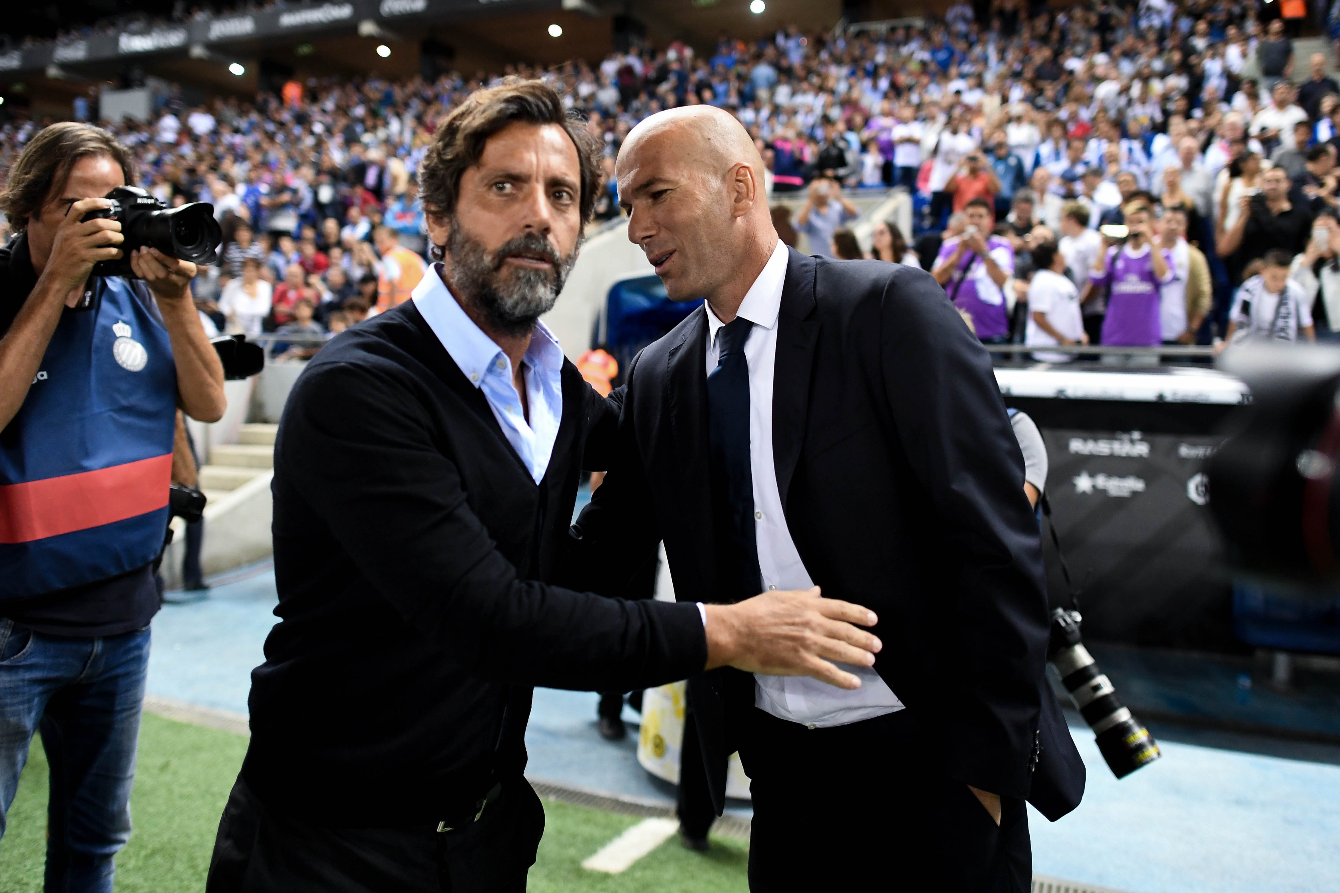 BARCELONA, SPAIN - SEPTEMBER 18: Head coach Quique Sanchez Flores (L) of RCD Espanyol and Head coach Zinedine Zidane of Real Madrid CF shake hands prior to the La Liga match between RCD Espanyol and Real Madrid CF at the RCDE stadium on September 18, 2016 in Barcelona, Spain.  (Photo by David Ramos/Getty Images)
