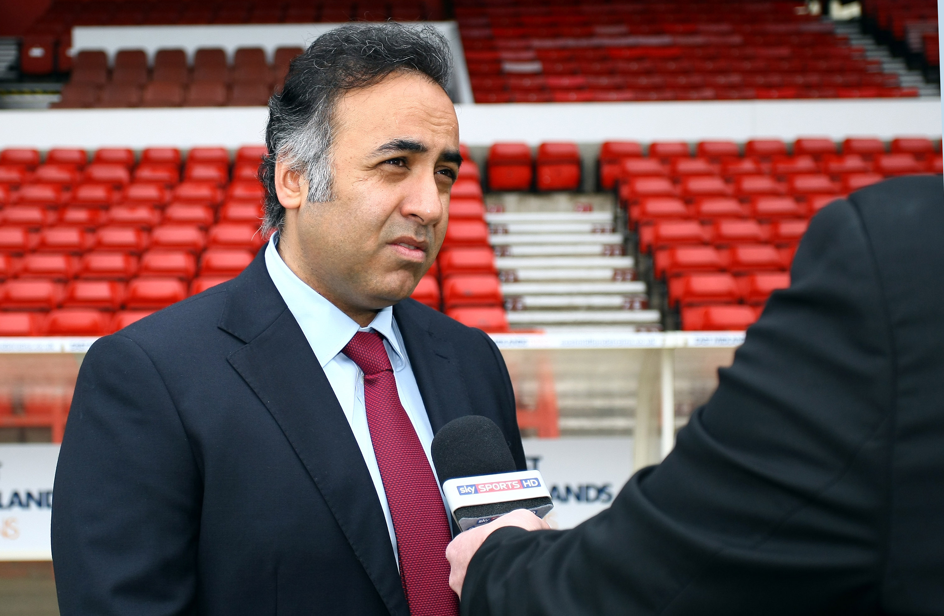 NOTTINGHAM, ENGLAND - APRIL 03: Nottingham Forest Chairman Fawaz Al Hasawi is interviewed pitch side after Stuart Pearce was unveiled as the new Nottingham Forest Manager at the City Ground on April 03, 2014 in Nottingham, England.  (Photo by Dan Westwell/Getty Images)