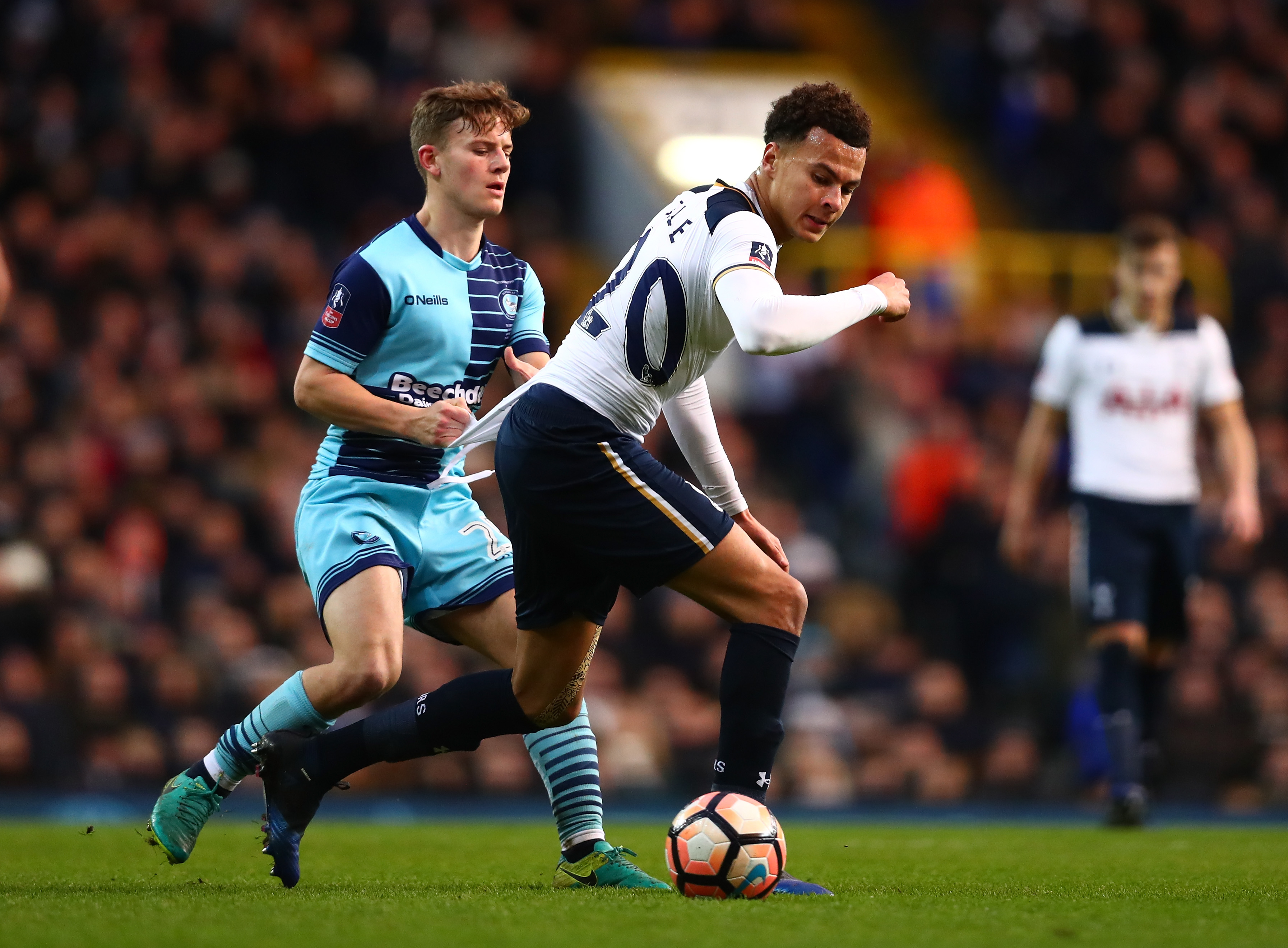 LONDON, ENGLAND - JANUARY 28: Dele Alli of Tottenham Hotspur and Scott Kashket of Wycombe Wanderers compete for the ball during the Emirates FA Cup Fourth Round match between Tottenham Hotspur and Wycombe Wanderers at White Hart Lane on January 28, 2017 in London, England.  (Photo by Dan Istitene/Getty Images)