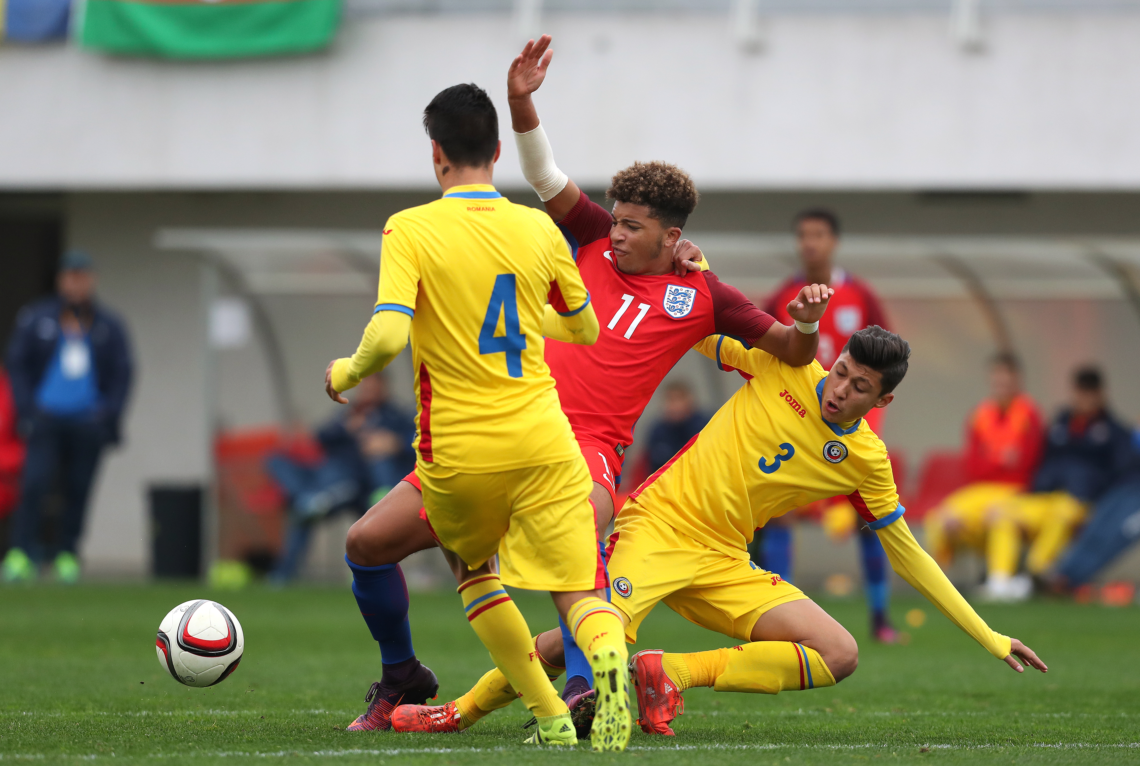 BUFTEA, ROMANIA - OCTOBER 27: Jadon Sancho (C) of England is attacked by Ricardo Farcas (L) and Darius Tieranu (R) of Romania during the UEFA Under-17 EURO Qualifier between U17 England and U17 Romania at Football Centre FRF on October 27, 2016 in Buftea, Romania. (Photo by Ronny Hartmann/Getty Images)