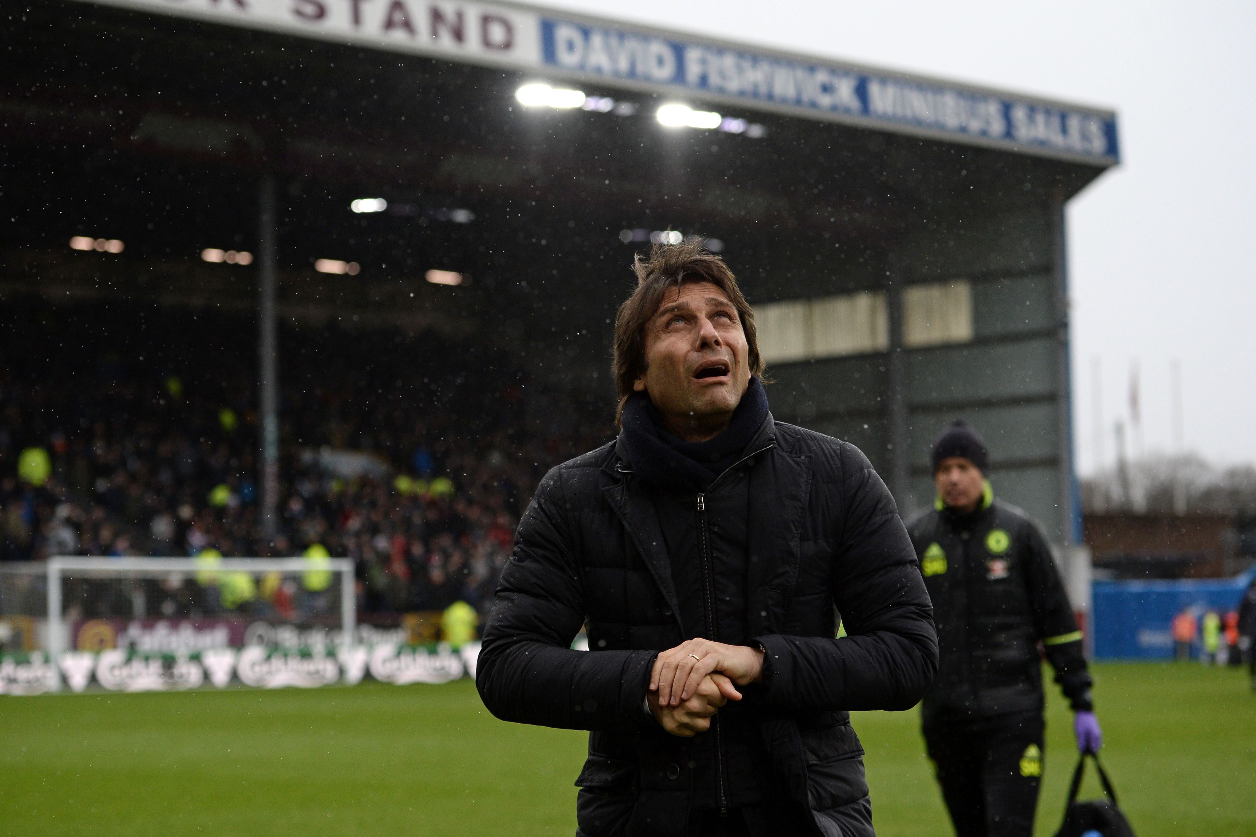 Chelsea's Italian head coach Antonio Conte arrives for the English Premier League football match between Burnley and Chelsea at Turf Moor in Burnley, north west England on February 12, 2017. / AFP / Oli SCARFF / RESTRICTED TO EDITORIAL USE. No use with unauthorized audio, video, data, fixture lists, club/league logos or 'live' services. Online in-match use limited to 75 images, no video emulation. No use in betting, games or single club/league/player publications.  /         (Photo credit should read OLI SCARFF/AFP/Getty Images)