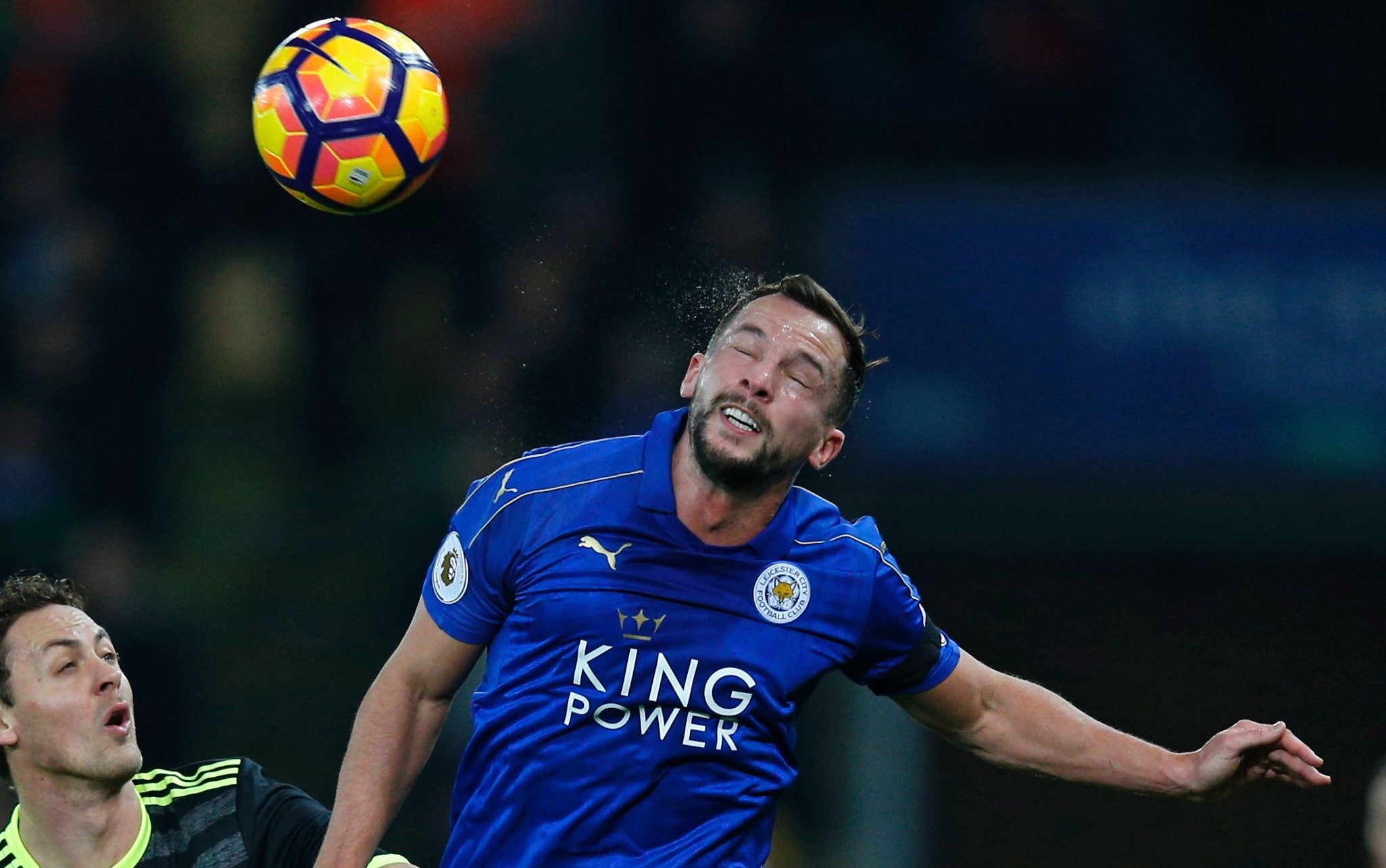 Leicester City's English midfielder Danny Drinkwater (R) wins a header as Chelsea's Spanish defender Marcos Alonso and Chelsea's Serbian midfielder Nemanja Matic (C) look on during the English Premier League football match between Leicester City and Chelsea at King Power Stadium in Leicester, central England on January 14, 2017. / AFP / Adrian DENNIS / RESTRICTED TO EDITORIAL USE. No use with unauthorized audio, video, data, fixture lists, club/league logos or 'live' services. Online in-match use limited to 75 images, no video emulation. No use in betting, games or single club/league/player publications.  /         (Photo credit should read ADRIAN DENNIS/AFP/Getty Images)