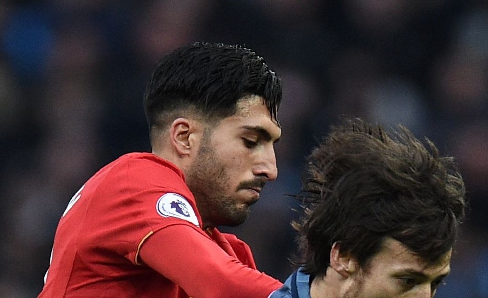 Liverpool's German midfielder Emre Can (2nd L) vies with Manchester City's Spanish midfielder David Silva during the English Premier League football match between Manchester City and Liverpool at the Etihad Stadium in Manchester, north west England, on March 19, 2017. / AFP PHOTO / Oli SCARFF / RESTRICTED TO EDITORIAL USE. No use with unauthorized audio, video, data, fixture lists, club/league logos or 'live' services. Online in-match use limited to 75 images, no video emulation. No use in betting, games or single club/league/player publications.  /         (Photo credit should read OLI SCARFF/AFP/Getty Images)