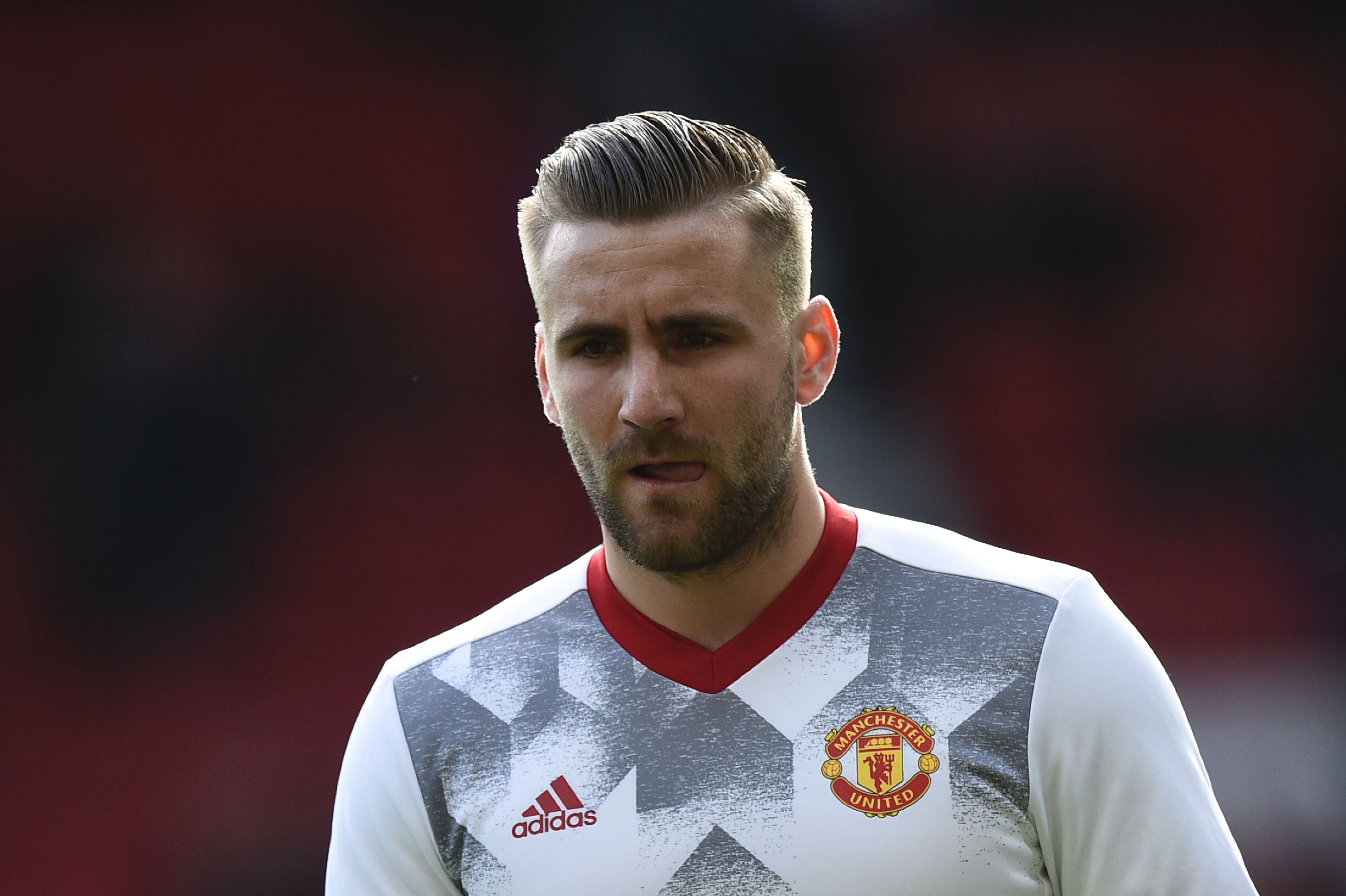 Manchester United's English defender Luke Shaw warms up before the English Premier League football match between Manchester United and Bournemouth at Old Trafford in Manchester, north west England, on March 4, 2017. / AFP PHOTO / Oli SCARFF / RESTRICTED TO EDITORIAL USE. No use with unauthorized audio, video, data, fixture lists, club/league logos or 'live' services. Online in-match use limited to 75 images, no video emulation. No use in betting, games or single club/league/player publications.  /         (Photo credit should read OLI SCARFF/AFP/Getty Images)