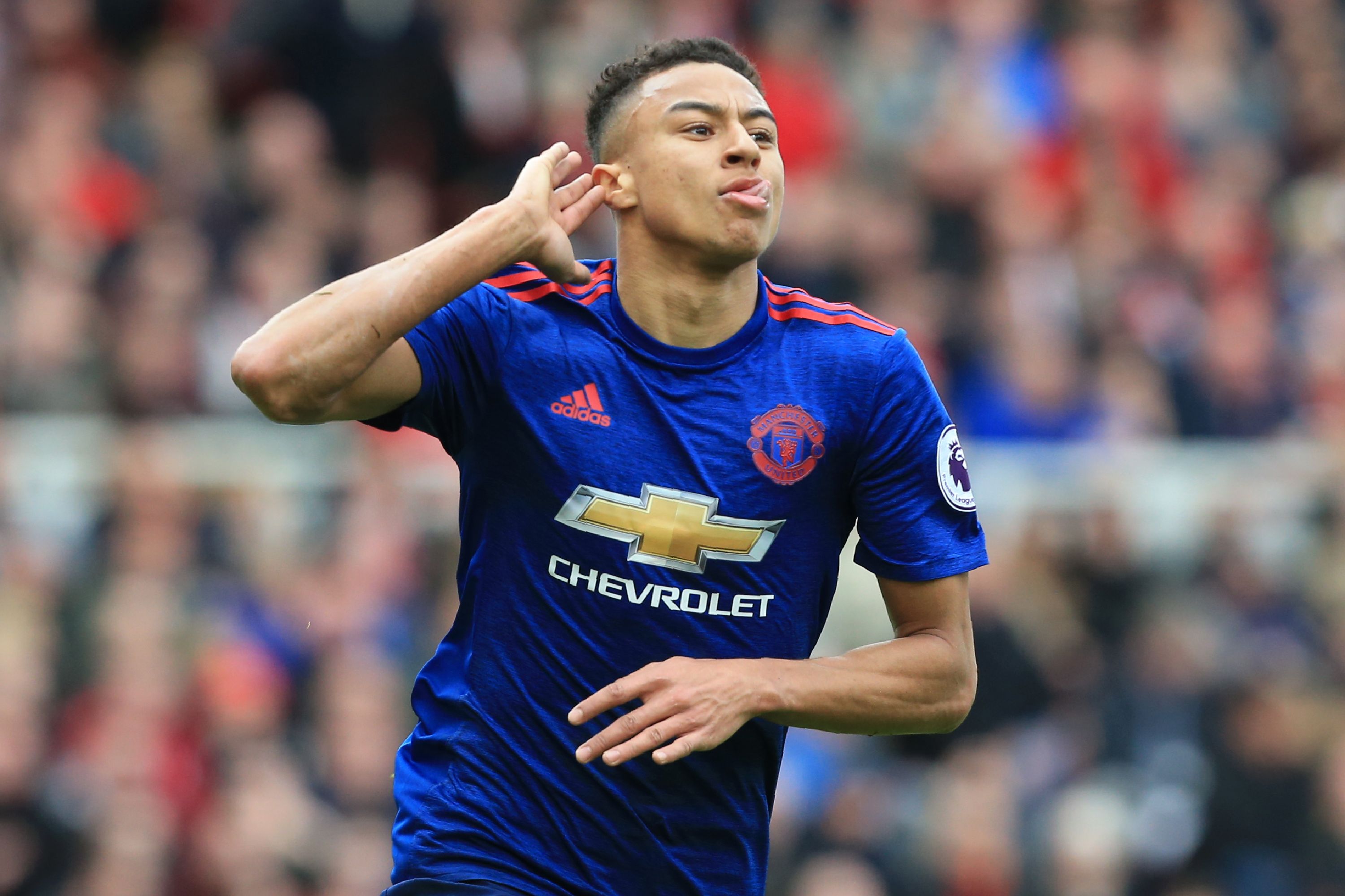 Manchester United's English midfielder Jesse Lingard celebrates after scoring their second goal during the English Premier League football match between Middlesbrough and Manchester United at Riverside Stadium in Middlesbrough, north east England on March 19, 2017. / AFP PHOTO / Lindsey PARNABY / RESTRICTED TO EDITORIAL USE. No use with unauthorized audio, video, data, fixture lists, club/league logos or 'live' services. Online in-match use limited to 75 images, no video emulation. No use in betting, games or single club/league/player publications.  /         (Photo credit should read LINDSEY PARNABY/AFP/Getty Images)