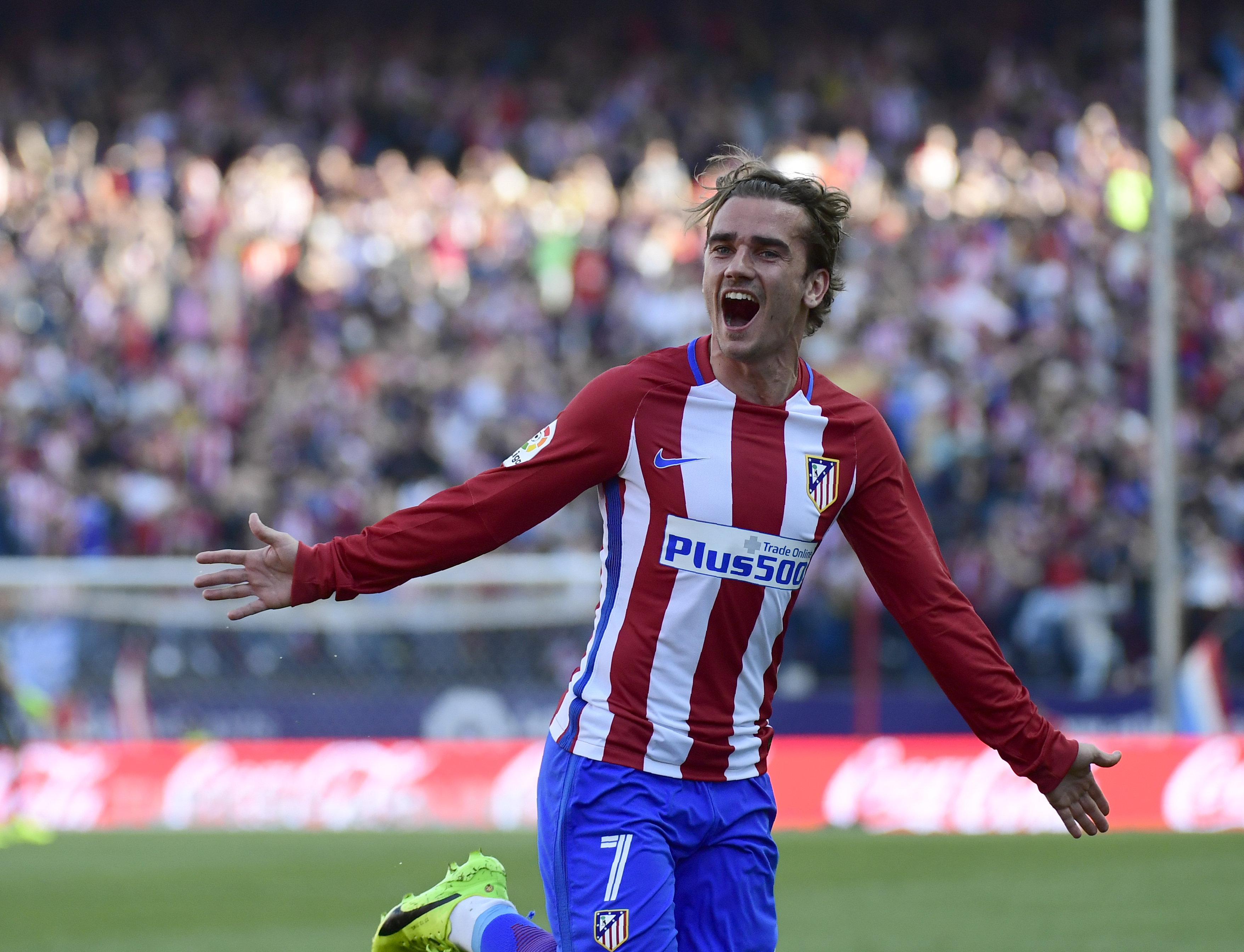 Atletico Madrid's French forward Antoine Griezmann celebrates after scoring during the Spanish league football match Club Atletico de Madrid vs Sevilla FC at the Vicente Calderon stadium in Madrid on March 19, 2017. / AFP PHOTO / PIERRE-PHILIPPE MARCOU        (Photo credit should read PIERRE-PHILIPPE MARCOU/AFP/Getty Images)