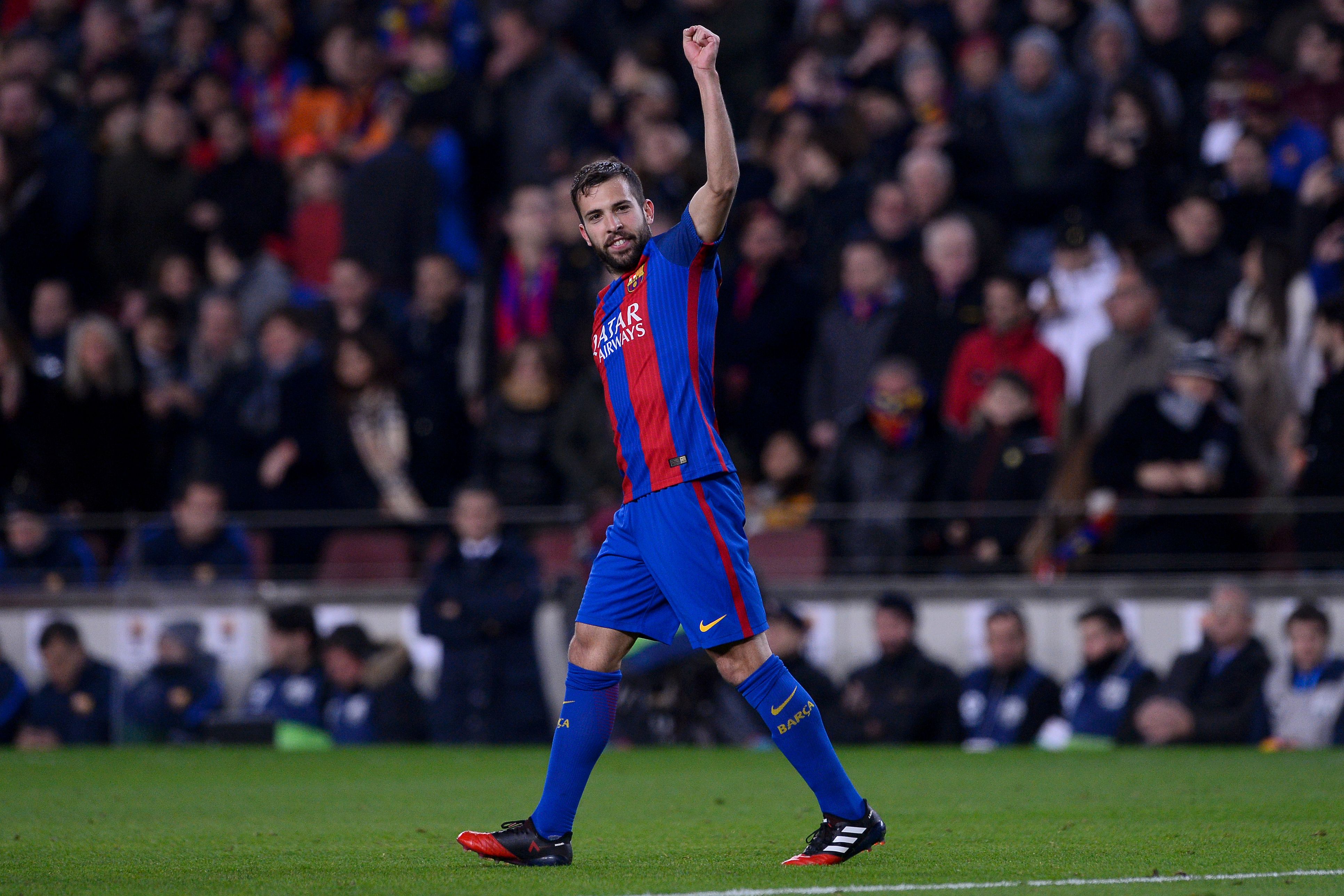 Barcelona's defender Jordi Alba celebrates his goal during the Spanish league football match FC Barcelona vs RCD Espanyol at the Camp Nou stadium in Barcelona on December 18, 2016. / AFP / JOSEP LAGO        (Photo credit should read JOSEP LAGO/AFP/Getty Images)