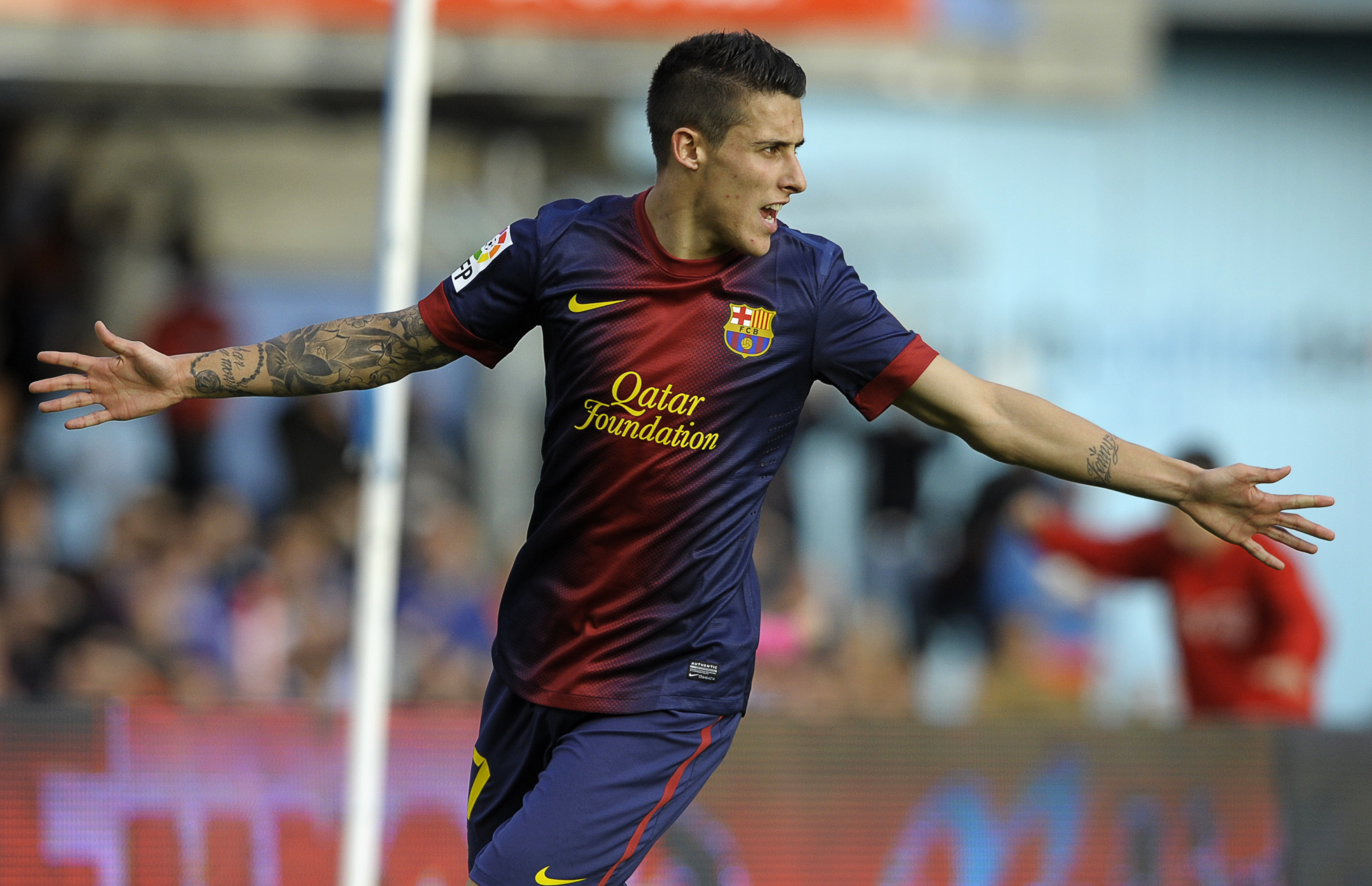 Barcelona's forward Cristian Tello celebrates after scoring during the Spanish league football match RC Celta de Vigo vs FC Barcelona at the Balaidos Stadium in Vigo on March 30, 2013.  AFP PHOTO / MIGUEL RIOPA        (Photo credit should read MIGUEL RIOPA/AFP/Getty Images)