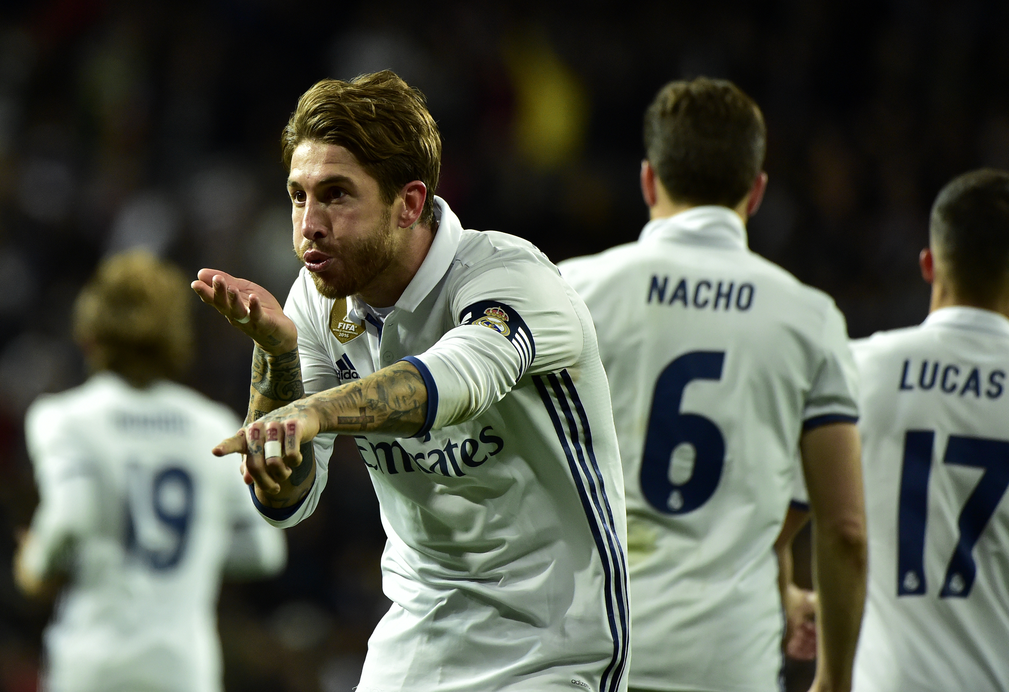 Real Madrid's defender Sergio Ramos celebrates after scoring a goal during the Spanish league footbal match Real Madrid CF vs Real Betis at the Santiago Bernabeu stadium in Madrid on March 12, 2017. / AFP PHOTO / GERARD JULIEN        (Photo credit should read GERARD JULIEN/AFP/Getty Images)