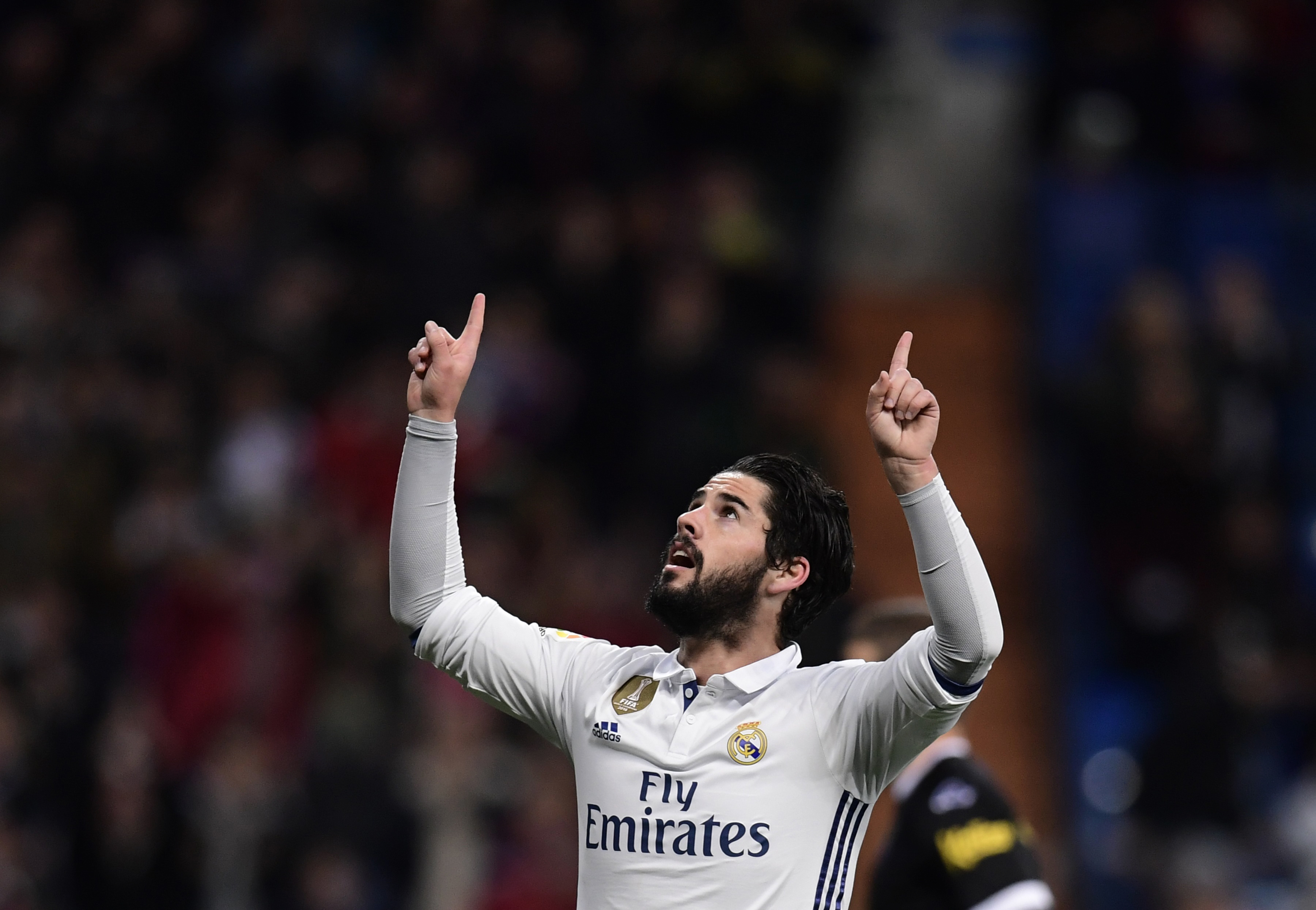 Real Madrid's midfielder Isco celebrates after scoring during the Spanish league football match Real Madrid CF vs UD Las Palmas at the Santiago Bernabeu stadium in Madrid on March 1, 2017. / AFP PHOTO / JAVIER SORIANO        (Photo credit should read JAVIER SORIANO/AFP/Getty Images)