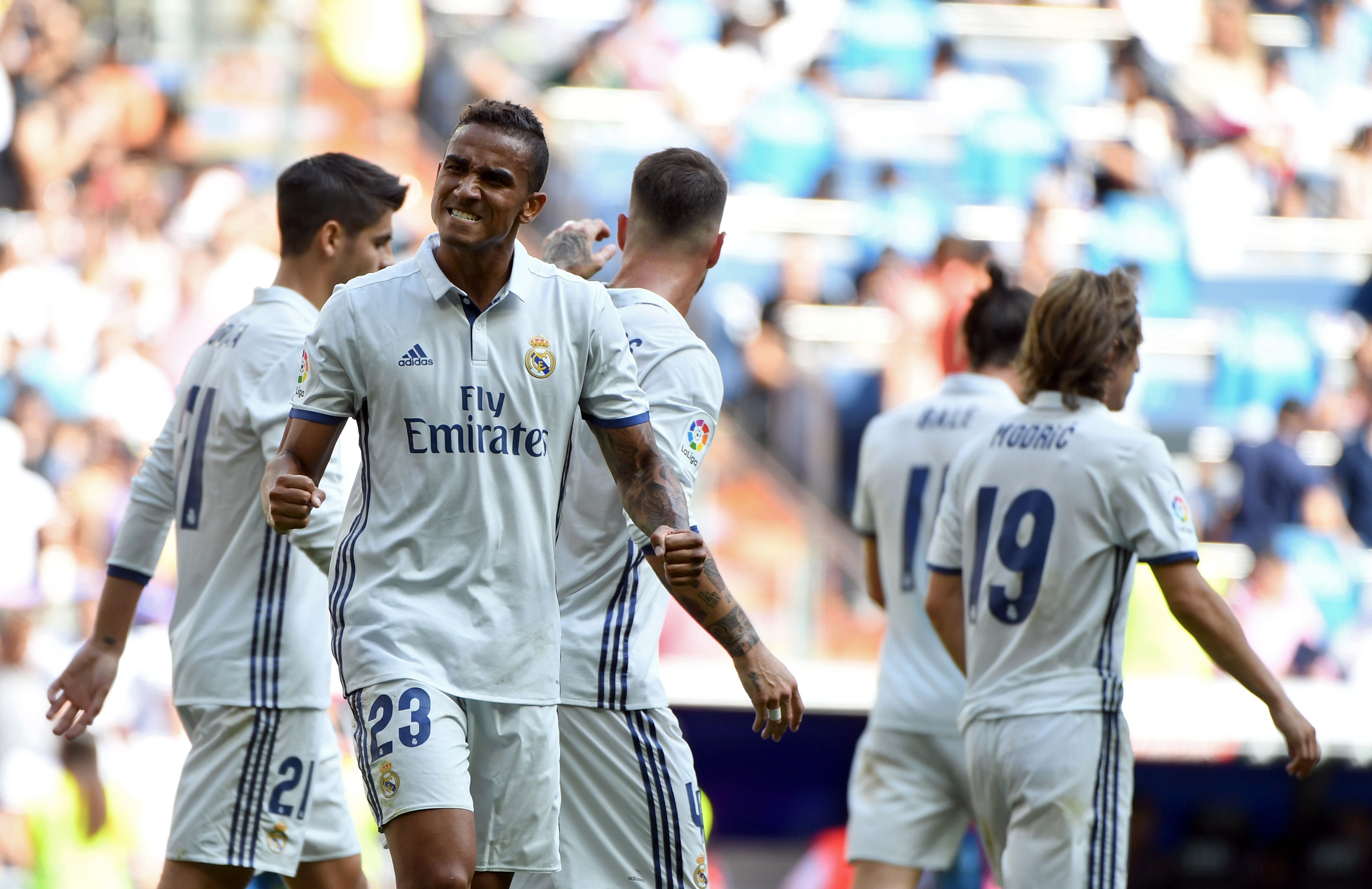 Real Madrid's Brazilian defender Danilo (L) celebrates after scoring during the Spanish league football match Real Madrid CF vs CA Osasuna at the Santiago Bernabeu stadium in Madrid on September 10, 2016. / AFP / GERARD JULIEN        (Photo credit should read GERARD JULIEN/AFP/Getty Images)