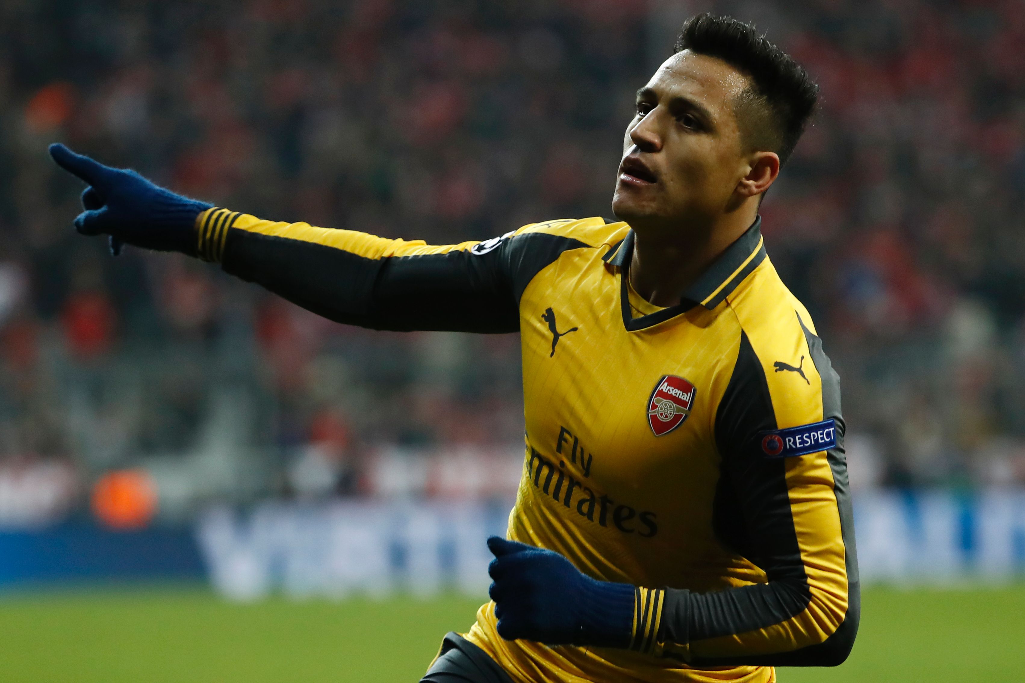 Arsenal's Chilean striker Alexis Sanchez celebrates scoring the 1-1 goal during the UEFA Champions League round of sixteen football match between FC Bayern Munich and Arsenal in Munich, southern Germany, on February 15, 2017.  / AFP / Odd ANDERSEN        (Photo credit should read ODD ANDERSEN/AFP/Getty Images)