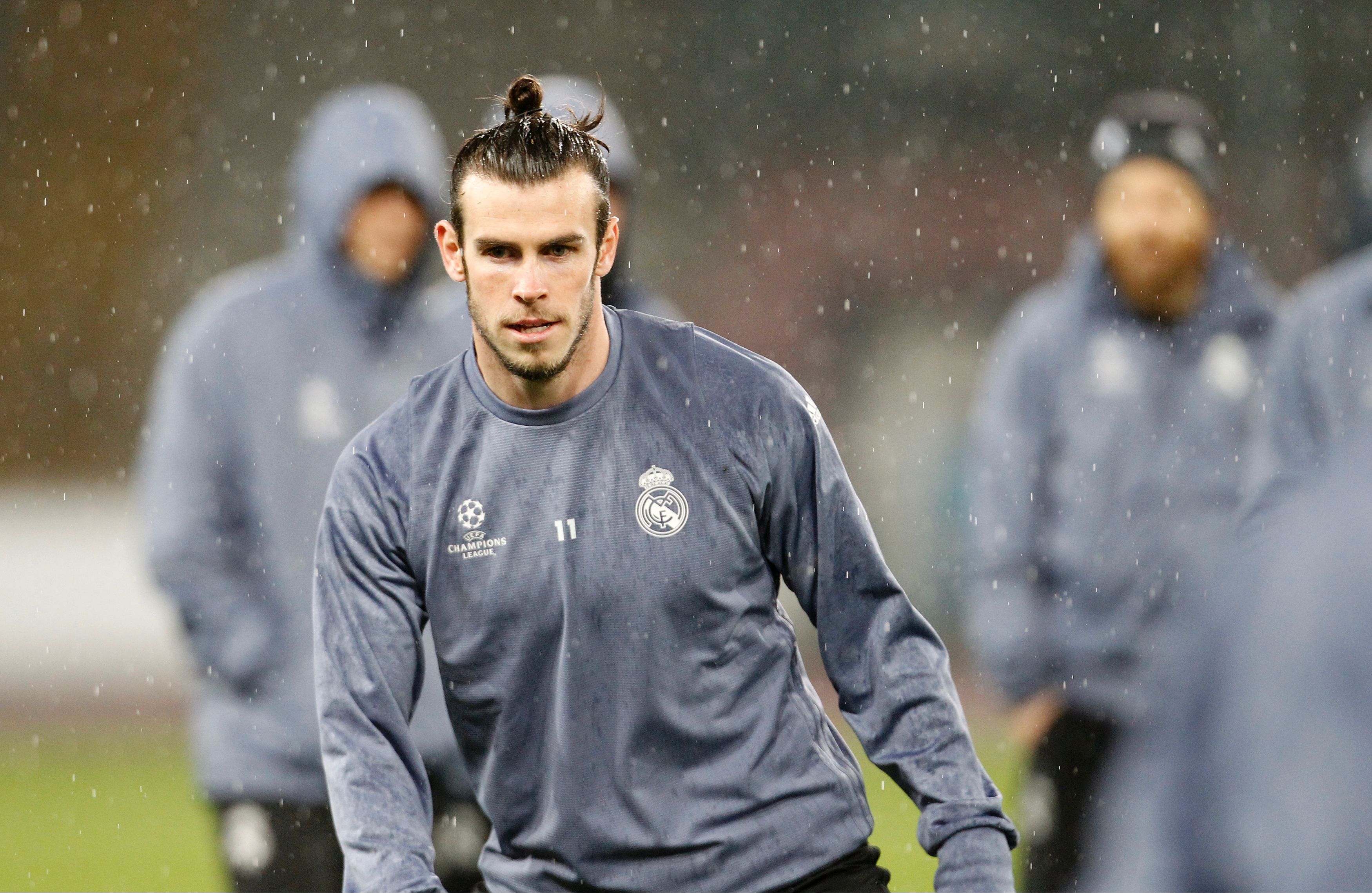 Real Madrid's Welsh forward Gareth Bale attends a training session under heavy rain on the eve of the Champions League football match Napoli vs Real Madrid on March 6, 2017 at the San Paolo stadium in Naples. / AFP PHOTO / CARLO HERMANN        (Photo credit should read CARLO HERMANN/AFP/Getty Images)