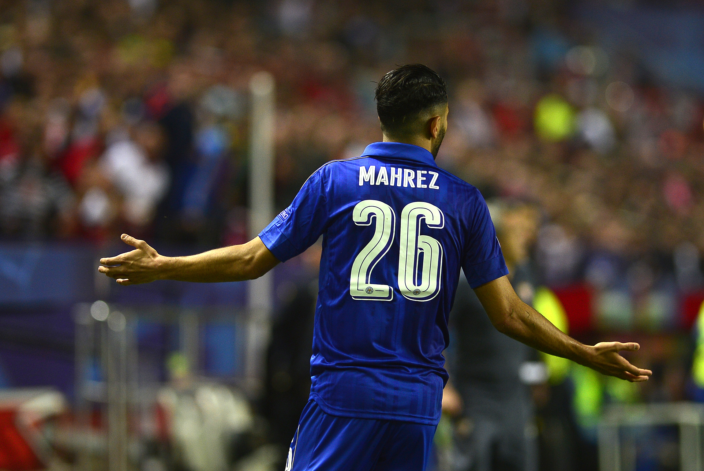 Leicester City's Algerian midfielder Riyad Mahrez gestures to the referee during the UEFA Champions League round of 16 second leg football match Sevilla FC vs Leicester City at the Ramon Sanchez Pizjuan stadium in Sevilla on February 22, 2017. / AFP / CRISTINA QUICLER        (Photo credit should read CRISTINA QUICLER/AFP/Getty Images)