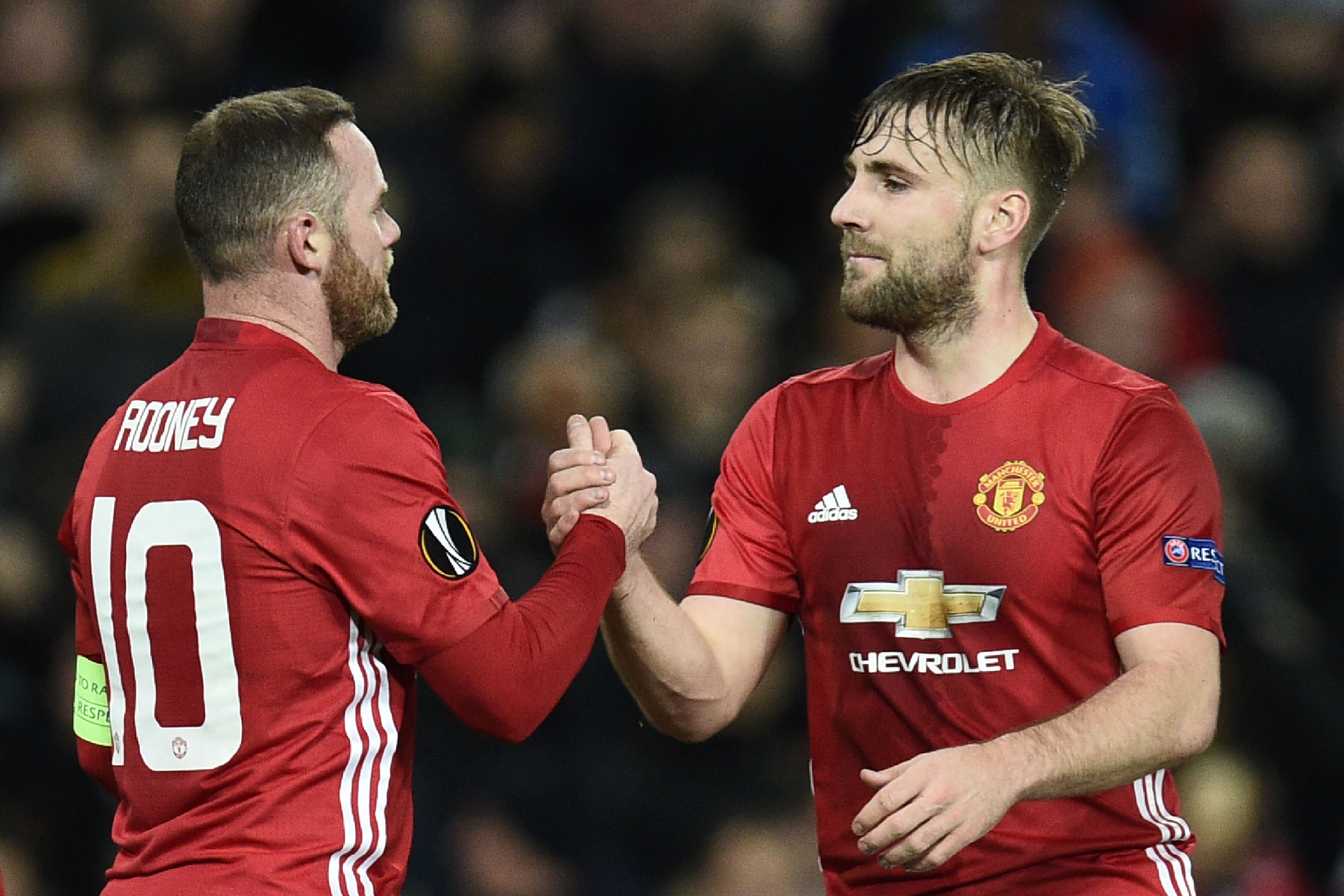 Manchester United's English striker Wayne Rooney (L) celebrates scoring the opening goal with Manchester United's English defender Luke Shaw (R) during the UEFA Europa League group A football match between Manchester United and Feyenoord at Old Trafford stadium in Manchester, north-west England, on November 24, 2016. / AFP / Oli SCARFF        (Photo credit should read OLI SCARFF/AFP/Getty Images)