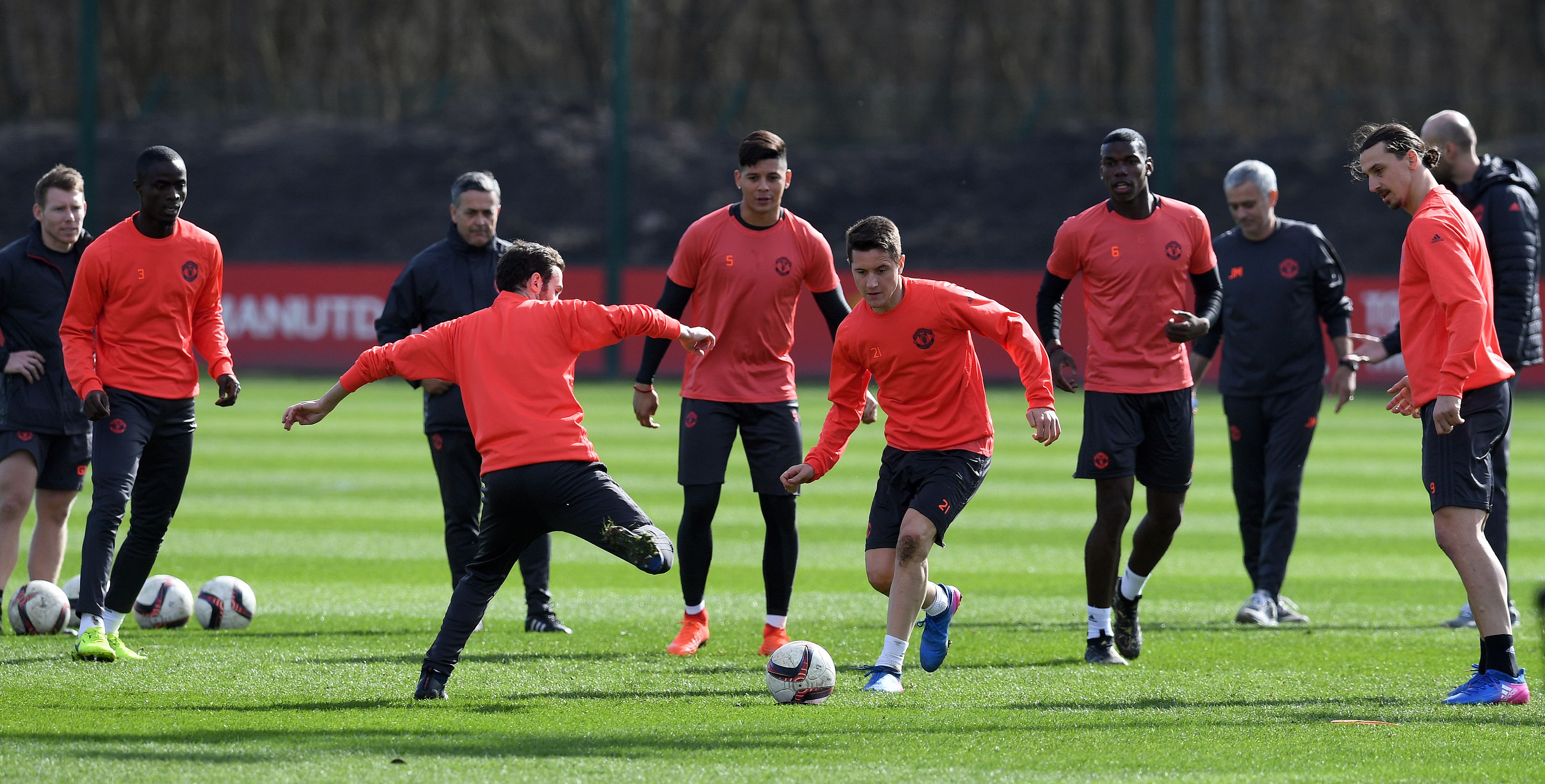 Manchester United's Spanish midfielder Juan Mata (4L) and Manchester United's Spanish midfielder Ander Herrera (C) vie for the ball as they take part in a training session at their Carrington base in Manchester, north west England, on March 15, 2017, on the eve of their UEFA Europa League Round of 16 second-leg football match against Rostov.  / AFP PHOTO / Paul ELLIS        (Photo credit should read PAUL ELLIS/AFP/Getty Images)
