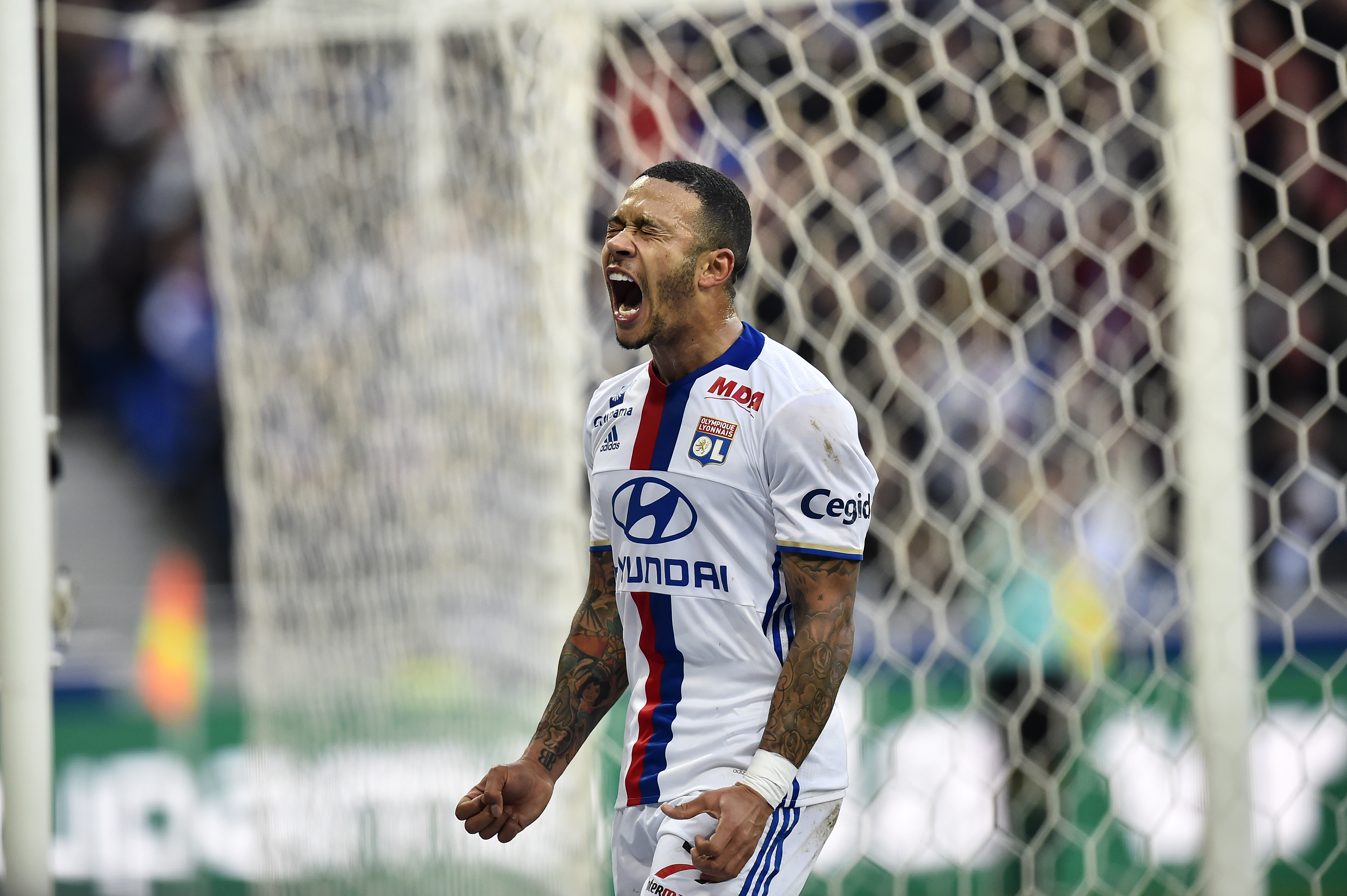 Lyon's Dutch forward Memphis Depay reacts during the French L1 football match between Olympique Lyonnais (OL) and Dijon (DFCO) on February 19, 2017, at the Parc Olympique Lyonnais stadium in Decines-Charpieu near Lyon, central-eastern France.  / AFP / ROMAIN LAFABREGUE        (Photo credit should read ROMAIN LAFABREGUE/AFP/Getty Images)