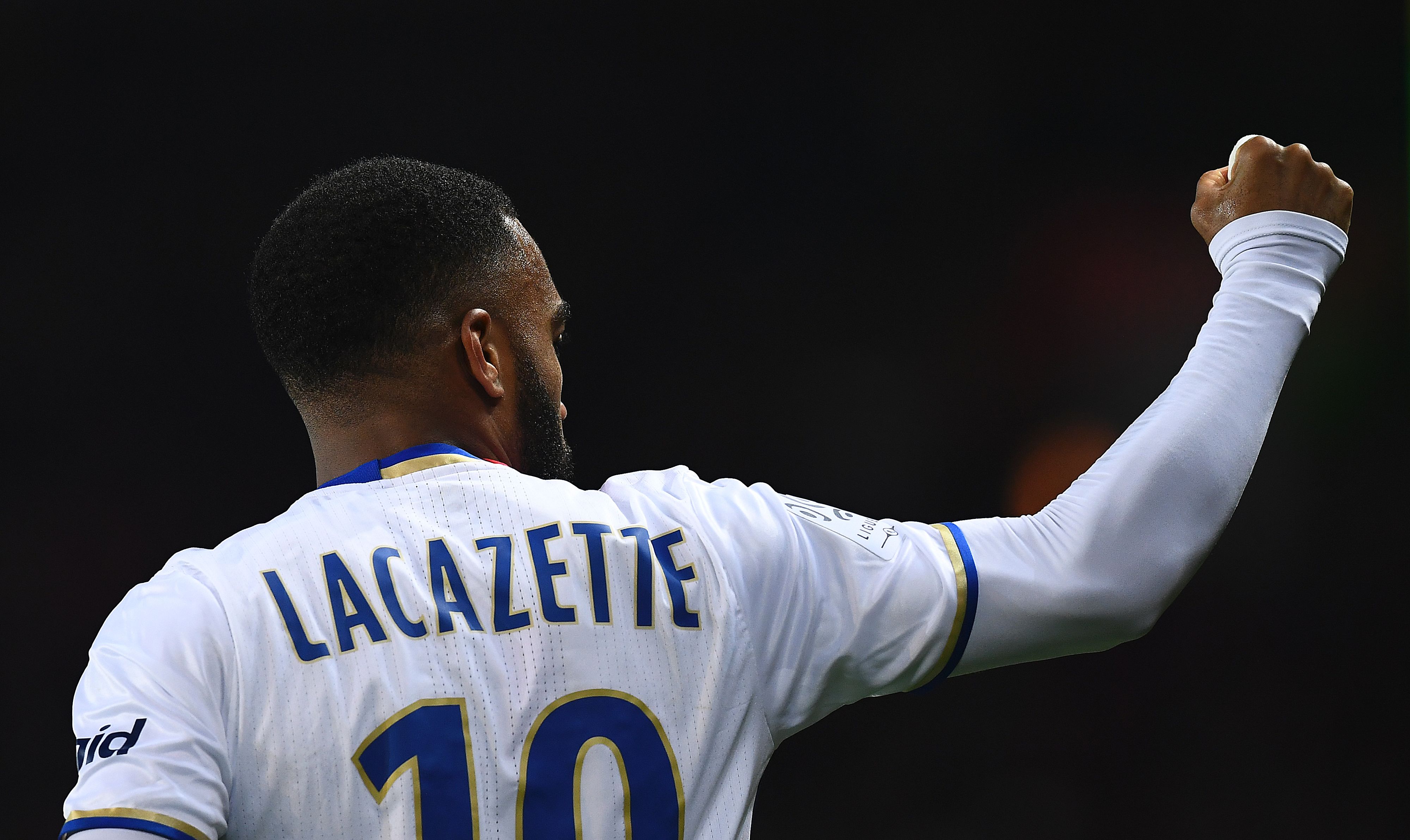 Lyon's French forward Alexandre Lacazette celebrates opening the scoring during the French L1 football match Paris Saint-Germain (PSG) vs Olympique Lyonnais (OL) at the Parc des Princes stadium in Paris on March 19, 2017.  / AFP PHOTO / FRANCK FIFE        (Photo credit should read FRANCK FIFE/AFP/Getty Images)