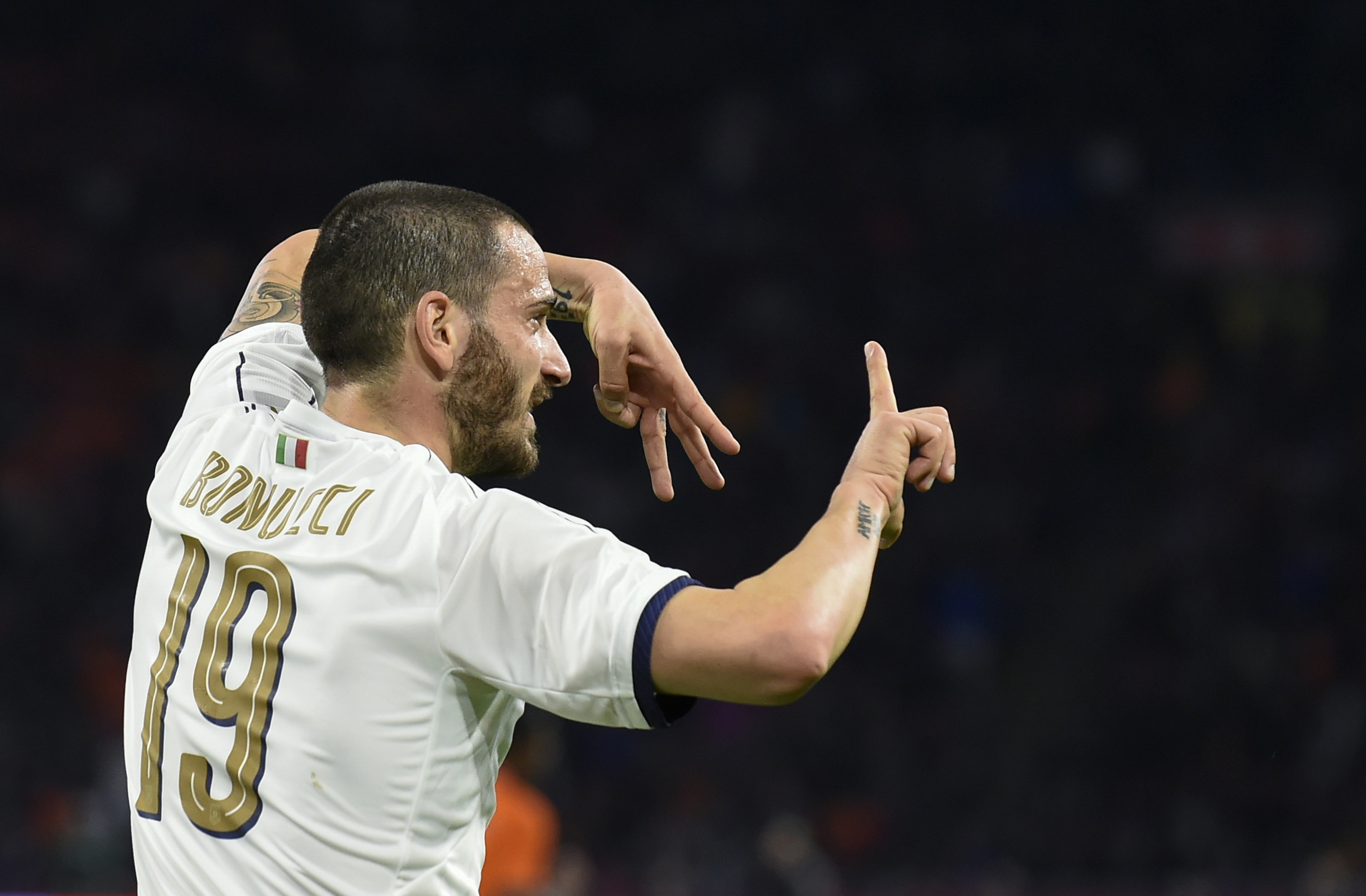 Italy's Leonardo Bonucci celebrates after scoring a goal during the friendly football match between The Netherlands and Italy at the Arena Stadium, on March 28, 2017 in Amsterdam. / AFP PHOTO / JOHN THYS        (Photo credit should read JOHN THYS/AFP/Getty Images)