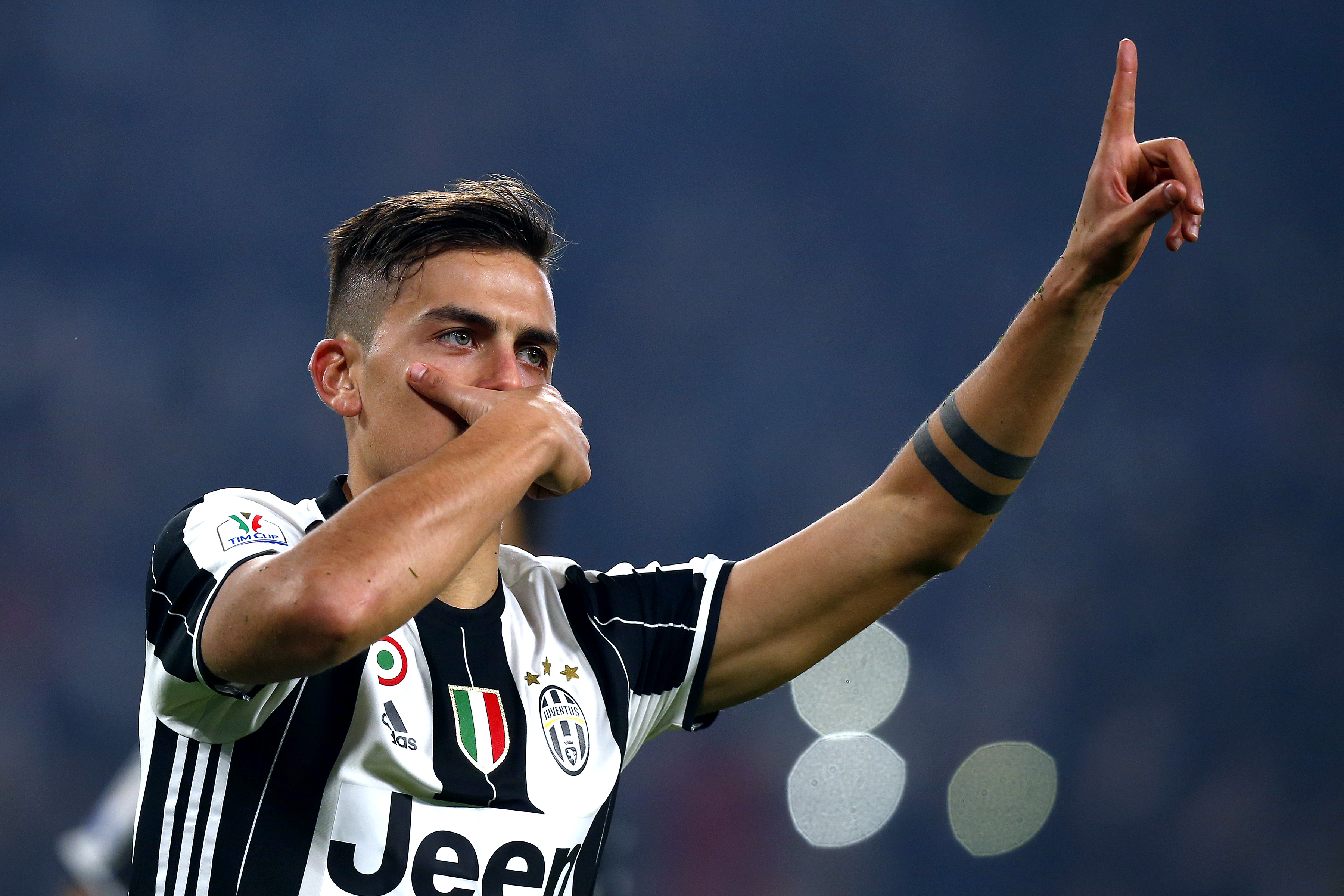 Juventus' forward Paulo Dybala from Argentina celebrates after scoring during the Italian Tim Cup football match between Juventus and Napoli on February 28, 2017, at the Juventus Stadium in Turin. / AFP / Marco BERTORELLO        (Photo credit should read MARCO BERTORELLO/AFP/Getty Images)