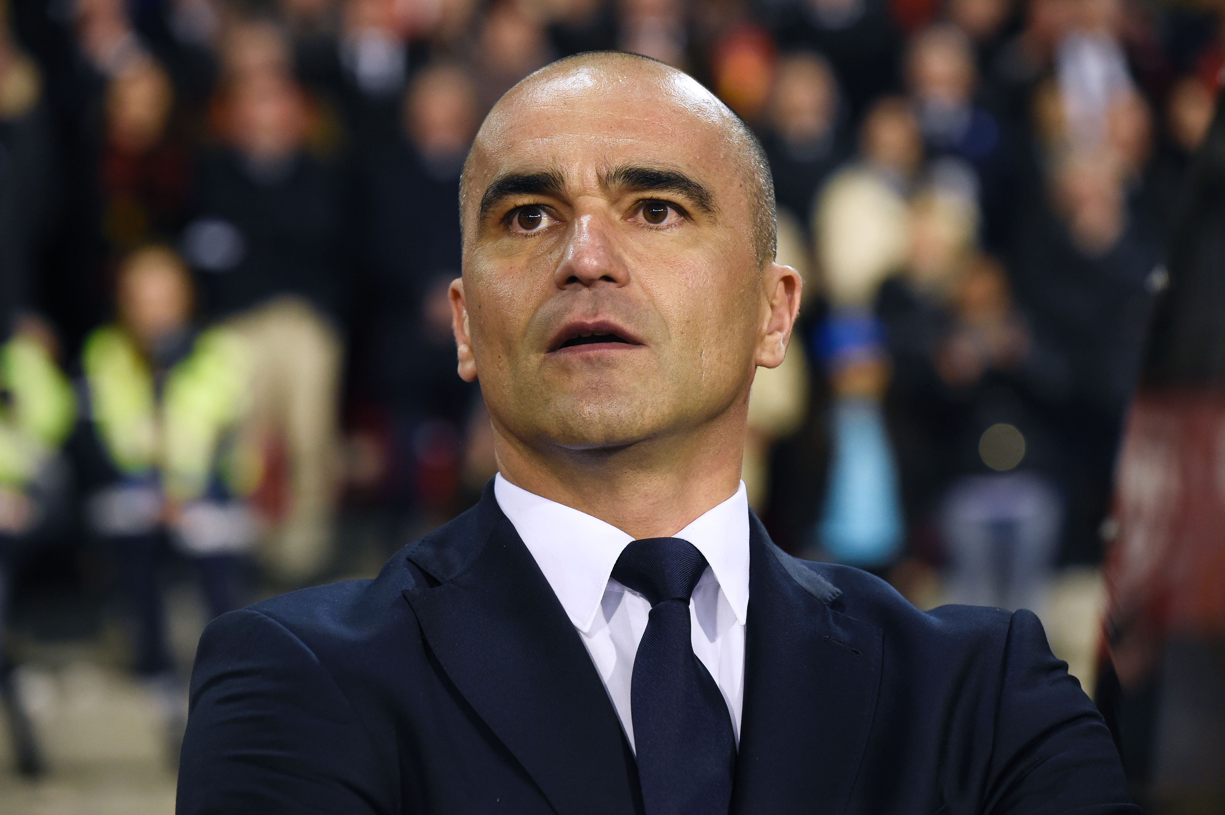 Belgium's head coach Roberto Martinez looks on during the line up for the national anthem before  the FIFA World Cup 2018 qualification football match between Belgium and Greece, at the King Baudouin Stadium, on March 25, 2017 in Brussels. / AFP PHOTO / JOHN THYS        (Photo credit should read JOHN THYS/AFP/Getty Images)