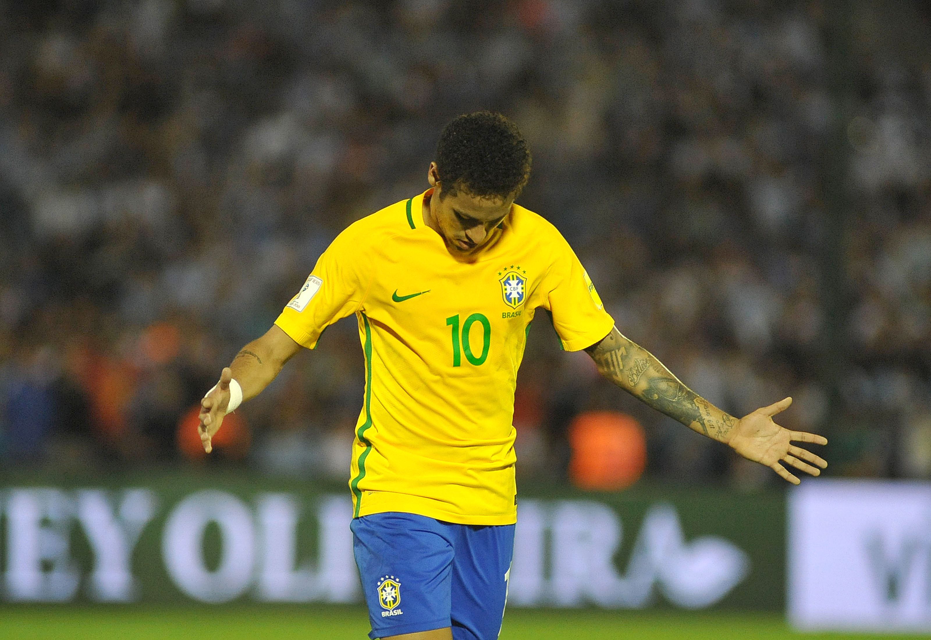 Brazil's Neymar celebrates his goal during their 2018 FIFA World Cup qualifier football match against Uruguay at the Centenario stadium in Montevideo, on March 23, 2017. / AFP PHOTO / DANTE FERNANDEZ        (Photo credit should read DANTE FERNANDEZ/AFP/Getty Images)