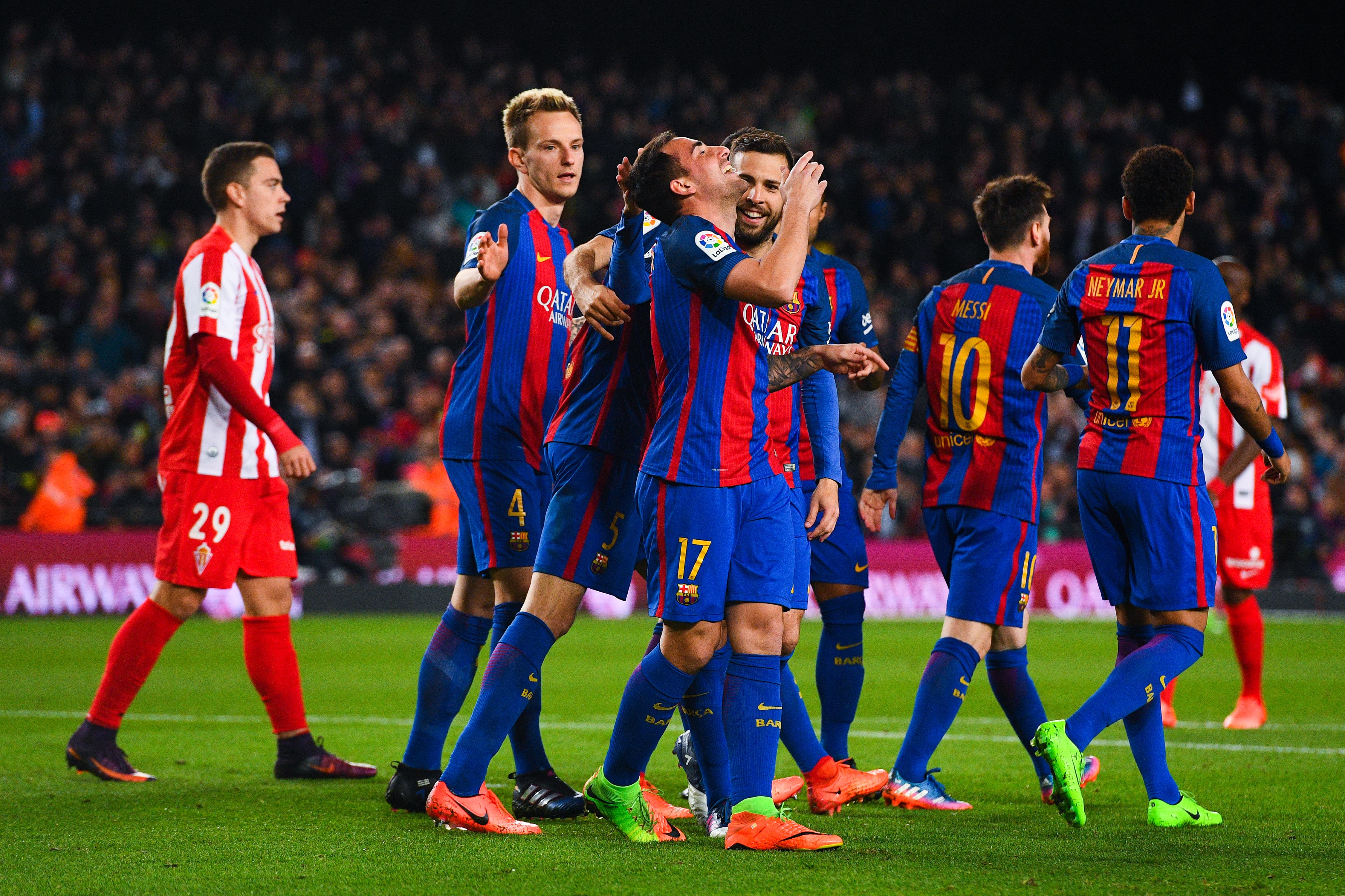 BARCELONA, SPAIN - MARCH 01:  Paco Alcacer of FC Barcelona celebrates with his team mates after scoring his team's fourth goal during the La Liga match between FC Barcelona and Real Sporting de Gijon at Camp Nou stadium on March 1, 2017 in Barcelona, Spain.  (Photo by David Ramos/Getty Images)