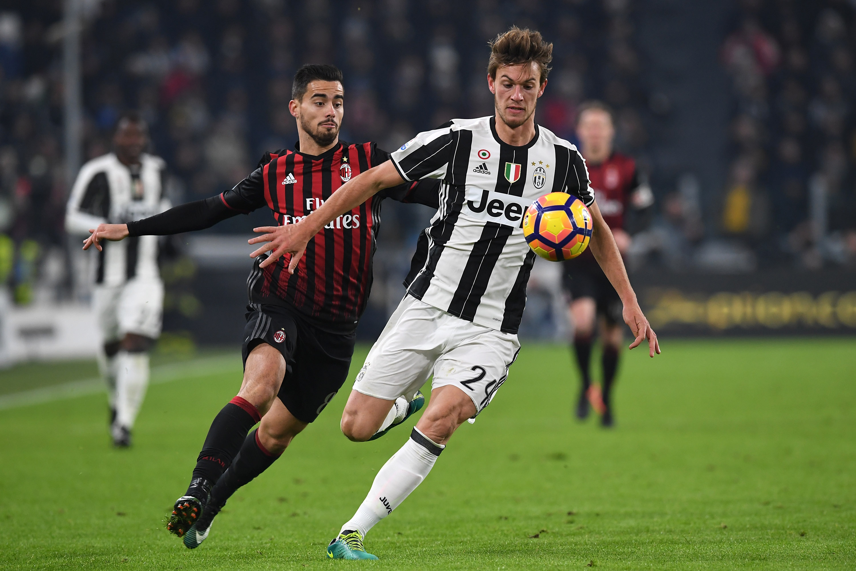 TURIN, ITALY - JANUARY 25:  Daniele Rugani (R) of Juventus FC is challenged by Fernandez Suso of AC Milan during the TIM Cup match between Juventus FC and AC Milan at Juventus Stadium on January 25, 2017 in Turin, Italy.  (Photo by Valerio Pennicino/Getty Images)