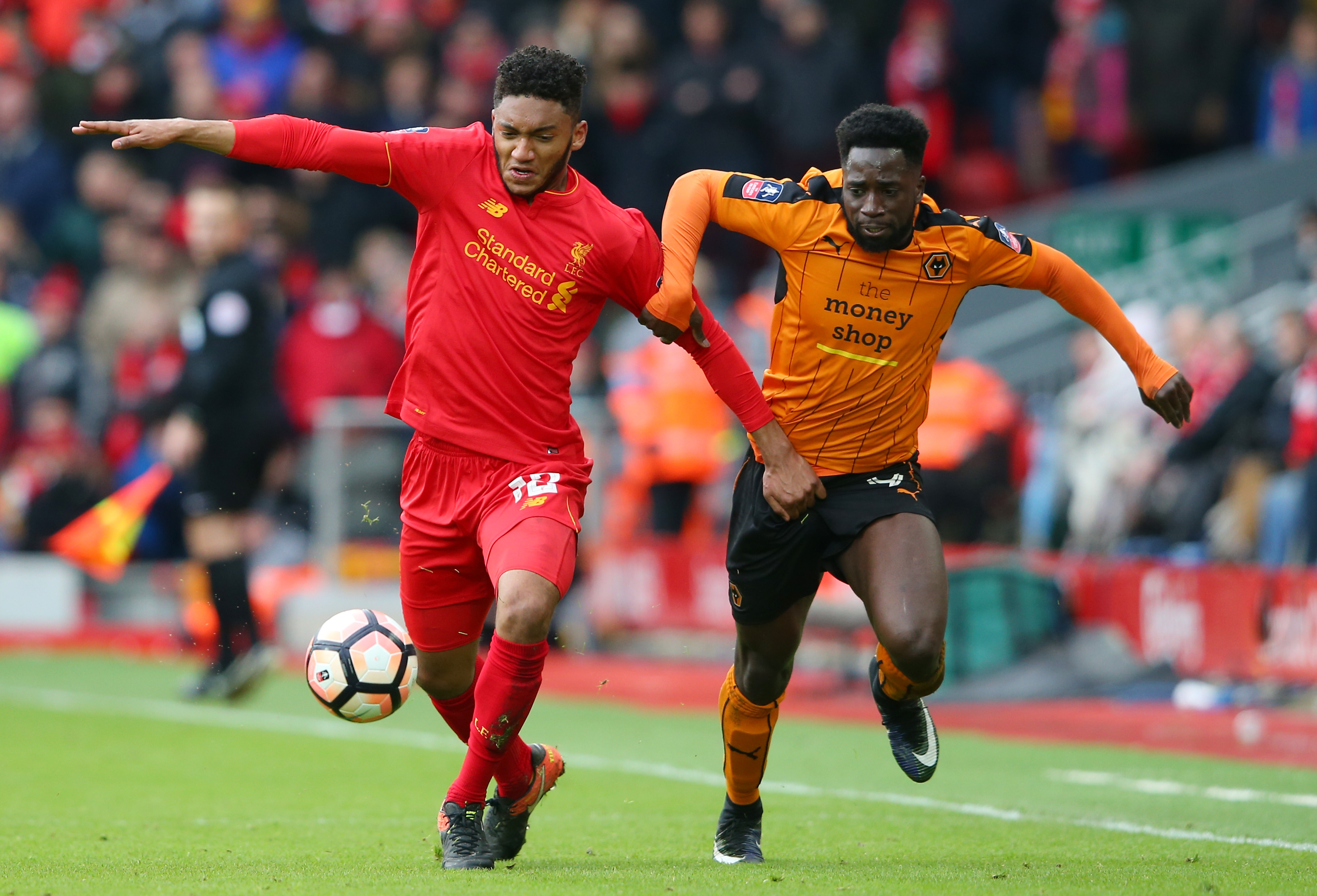 LIVERPOOL, ENGLAND - JANUARY 28:  Joe Gomez of Liverpool and Nouha Dicko of Wolverhampton Wanderers compete for the ball during the Emirates FA Cup Fourth Round match between Liverpool and Wolverhampton Wanderers at Anfield on January 28, 2017 in Liverpool, England.  (Photo by Alex Livesey/Getty Images)