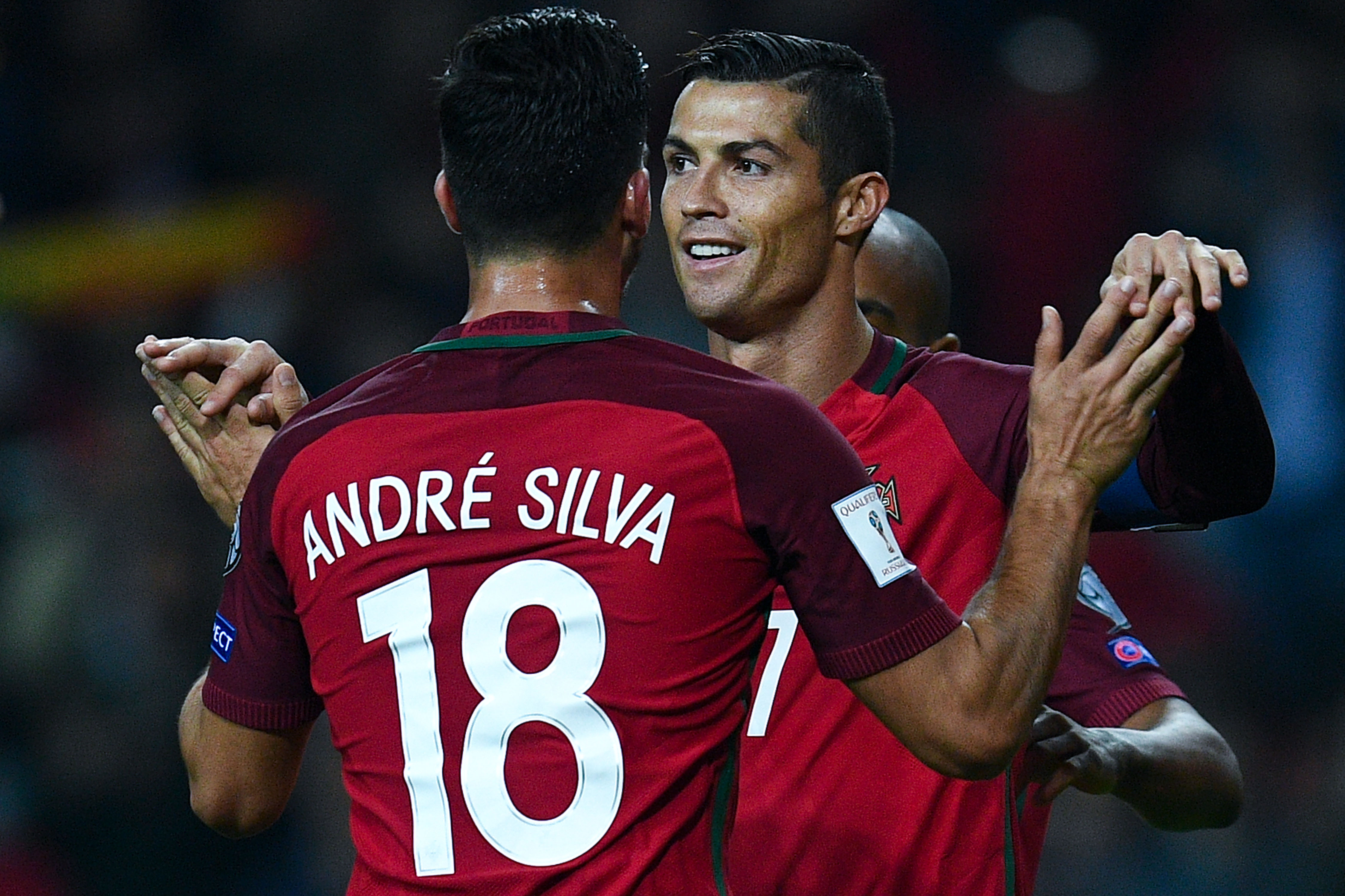 AVEIRO, PORTUGAL - OCTOBER 07:  Cristiano Ronaldo of Portugal celebrates with his team mate Andre Silva after scoring his team's fourth goal during the FIFA 2018 World Cup Qualifier between Portugal and Andorra at Estadio Municipal de Aveiro on October 7, 2016 in Aveiro, Portugal.  (Photo by David Ramos/Getty Images)