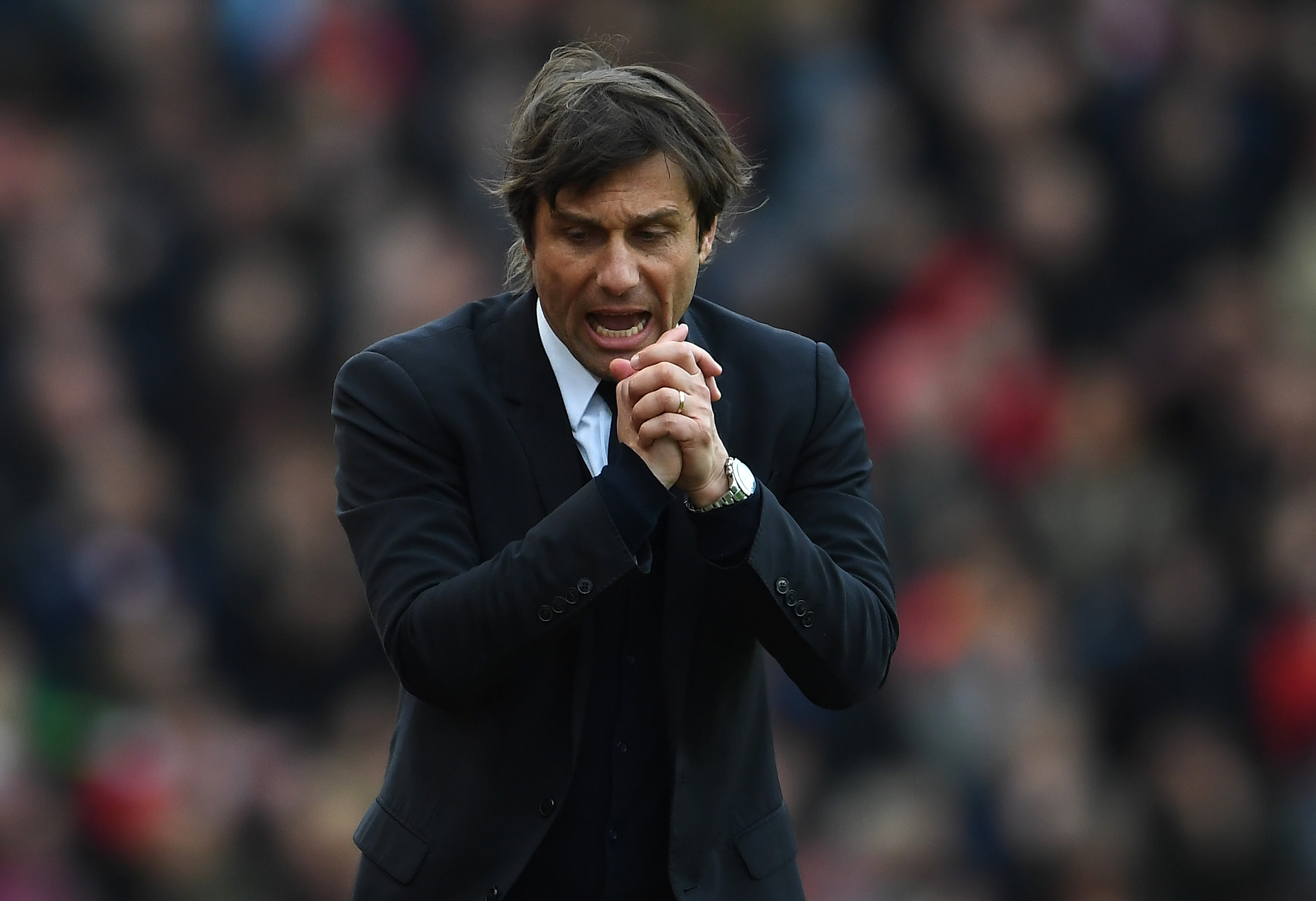 STOKE ON TRENT, ENGLAND - MARCH 18: Antonio Conte, Manager of Chelsea reacts during the Premier League match between Stoke City and Chelsea at Bet365 Stadium on March 18, 2017 in Stoke on Trent, England.  (Photo by Laurence Griffiths/Getty Images)