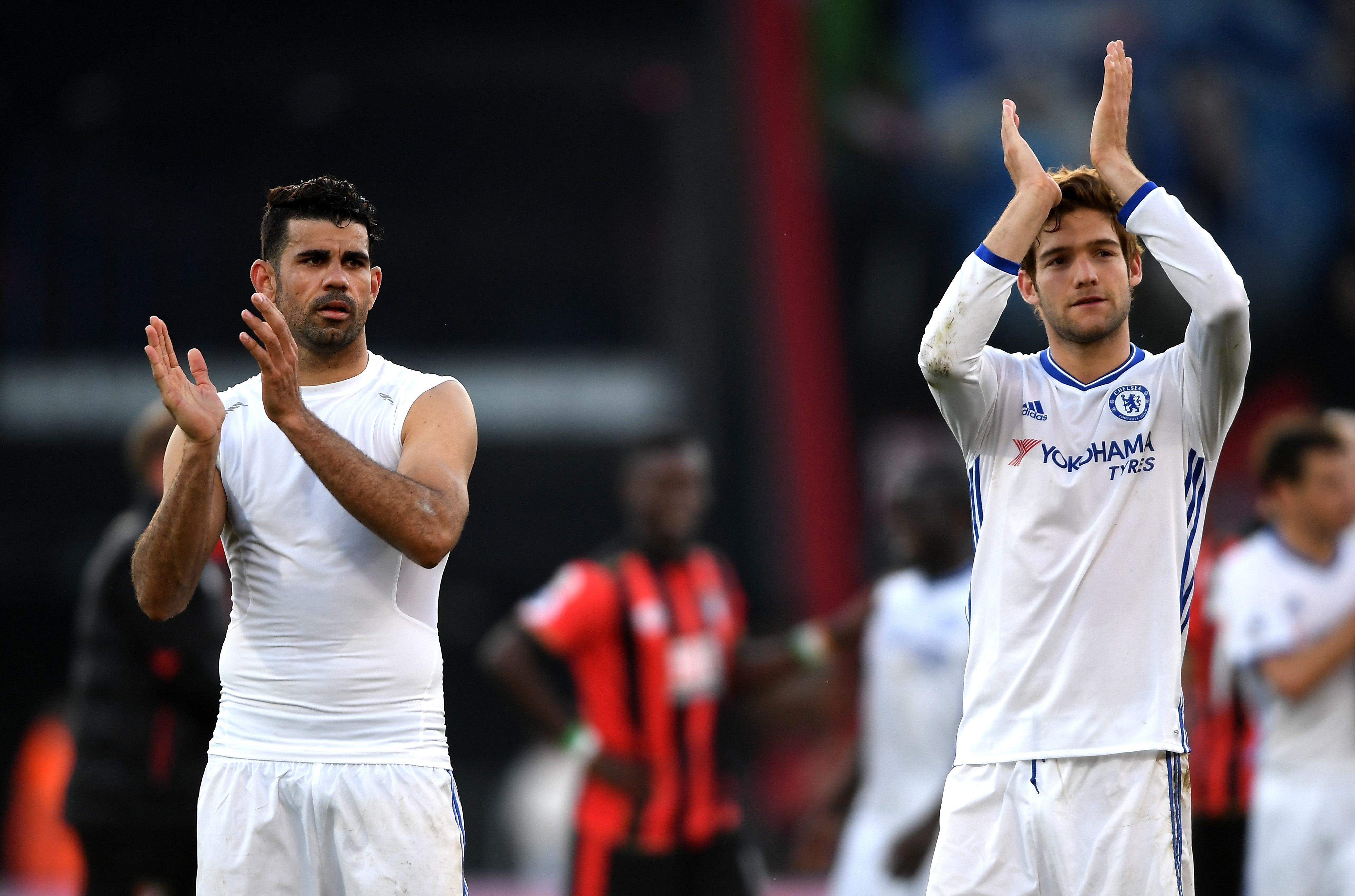 BOURNEMOUTH, ENGLAND - APRIL 08: Diego Costa of Chelsea (L) and Marcos Alonso of Chelsea (R) show appreciation to the fans after the Premier League match between AFC Bournemouth and Chelsea at Vitality Stadium on April 8, 2017 in Bournemouth, England.  (Photo by Mike Hewitt/Getty Images)