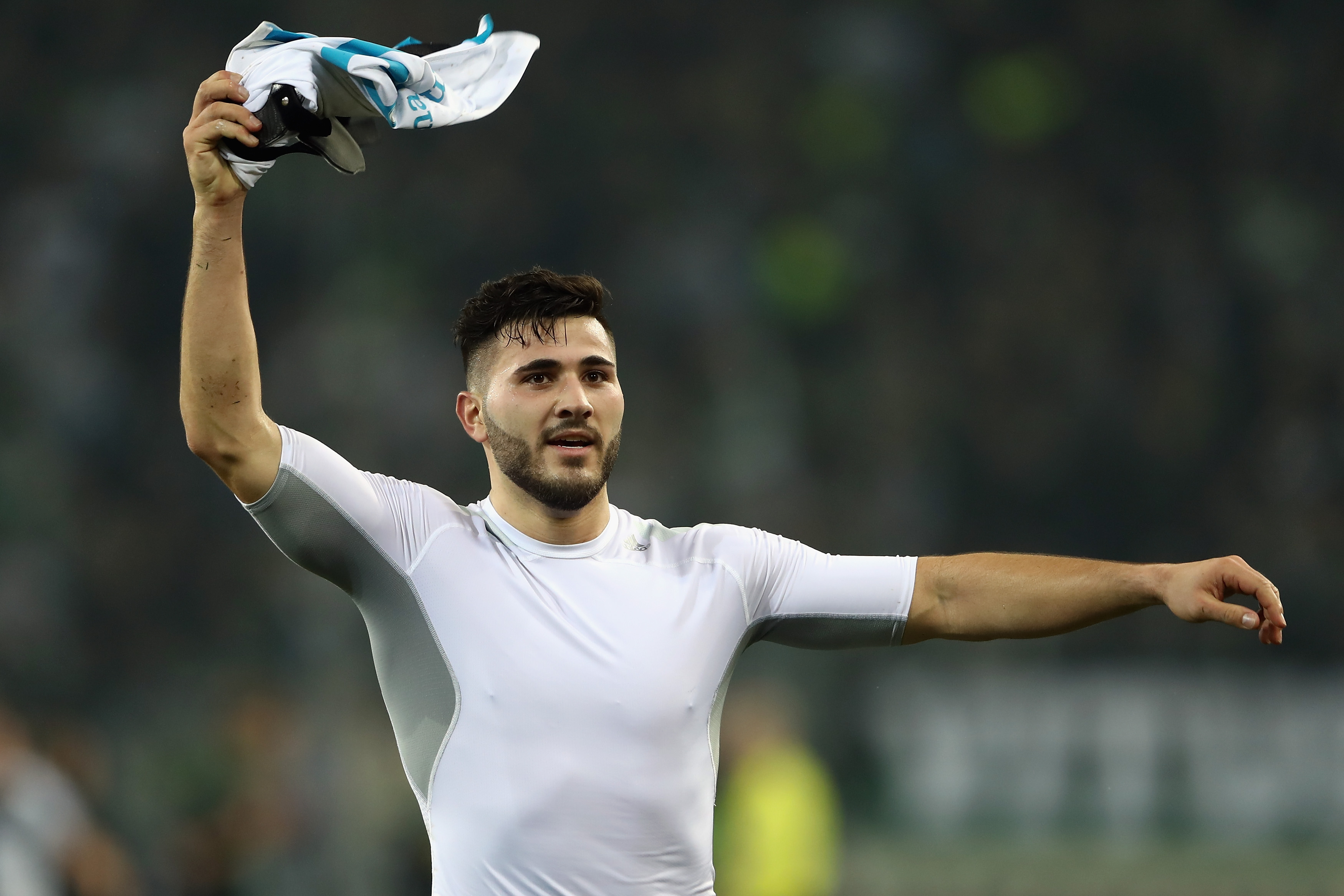 MOENCHENGLADBACH, GERMANY - MARCH 16: Sead Kolasinac of Schalke celebrates with the fans after the UEFA Europa  League Round of 16 second leg match between Borussia Moenchengladbach and FC Schalke 04 at Borussia Park Stadium on March 16, 2017 in Moenchengladbach, Germany.  (Photo by Alex Grimm/Bongarts/Getty Images )