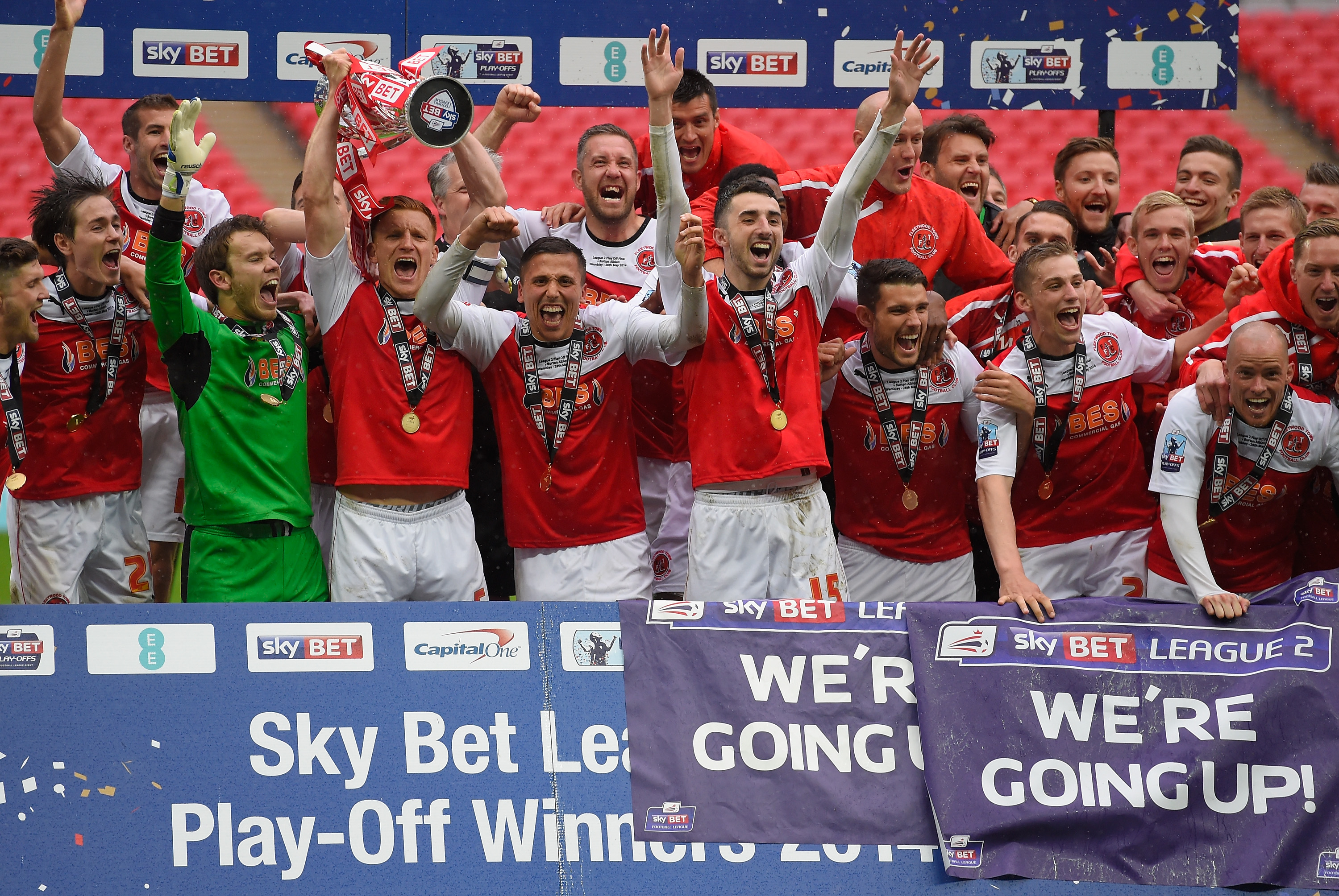 LONDON, ENGLAND - MAY 26:  Fleetwood players celebrate promotion from Division 2 after the Sky Bet League Two Playoff Final between Burton Albion and Fleetwood Town at Wembley Stadium on May 26, 2014 in London, England.  (Photo by Mike Hewitt/Getty Images)