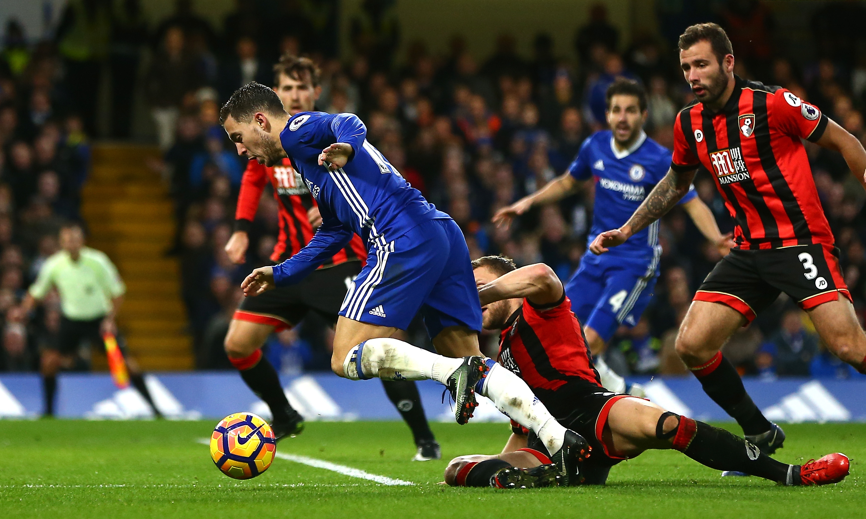 LONDON, ENGLAND - DECEMBER 26:  Eden Hazard of Chelsea is fouled by Simon Francis of AFC Bournemouth to award a penalty to Chelsea during the Premier League match between Chelsea and AFC Bournemouth at Stamford Bridge on December 26, 2016 in London, England.  (Photo by Jordan Mansfield/Getty Images)