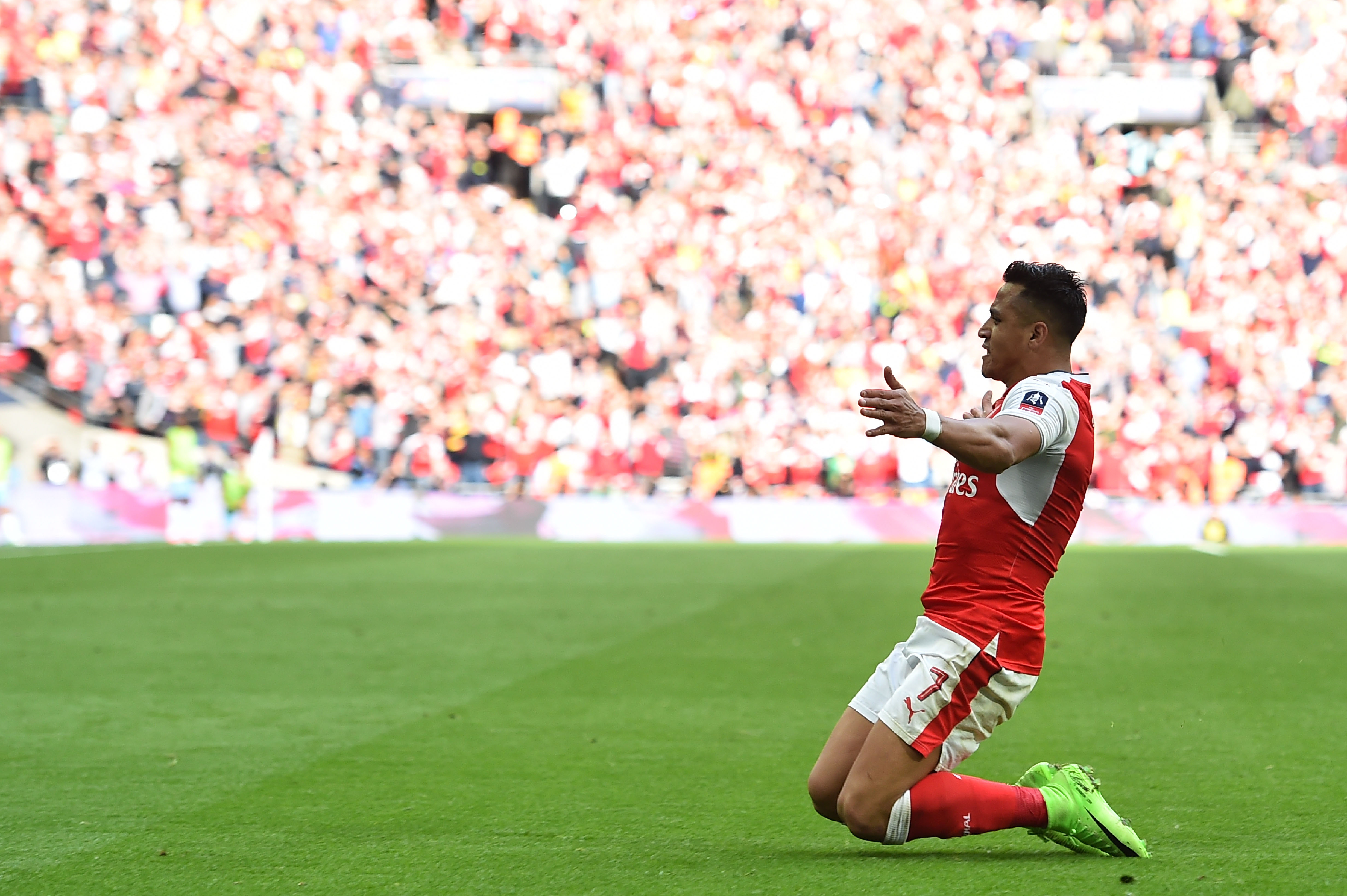 Arsenal's Chilean striker Alexis Sanchez celebrates scoring their second goal during the FA Cup semi-final football match between Arsenal and Manchester City at Wembley stadium in London on April 23, 2017. / AFP PHOTO / Glyn KIRK / NOT FOR MARKETING OR ADVERTISING USE / RESTRICTED TO EDITORIAL USE
        (Photo credit should read GLYN KIRK/AFP/Getty Images)