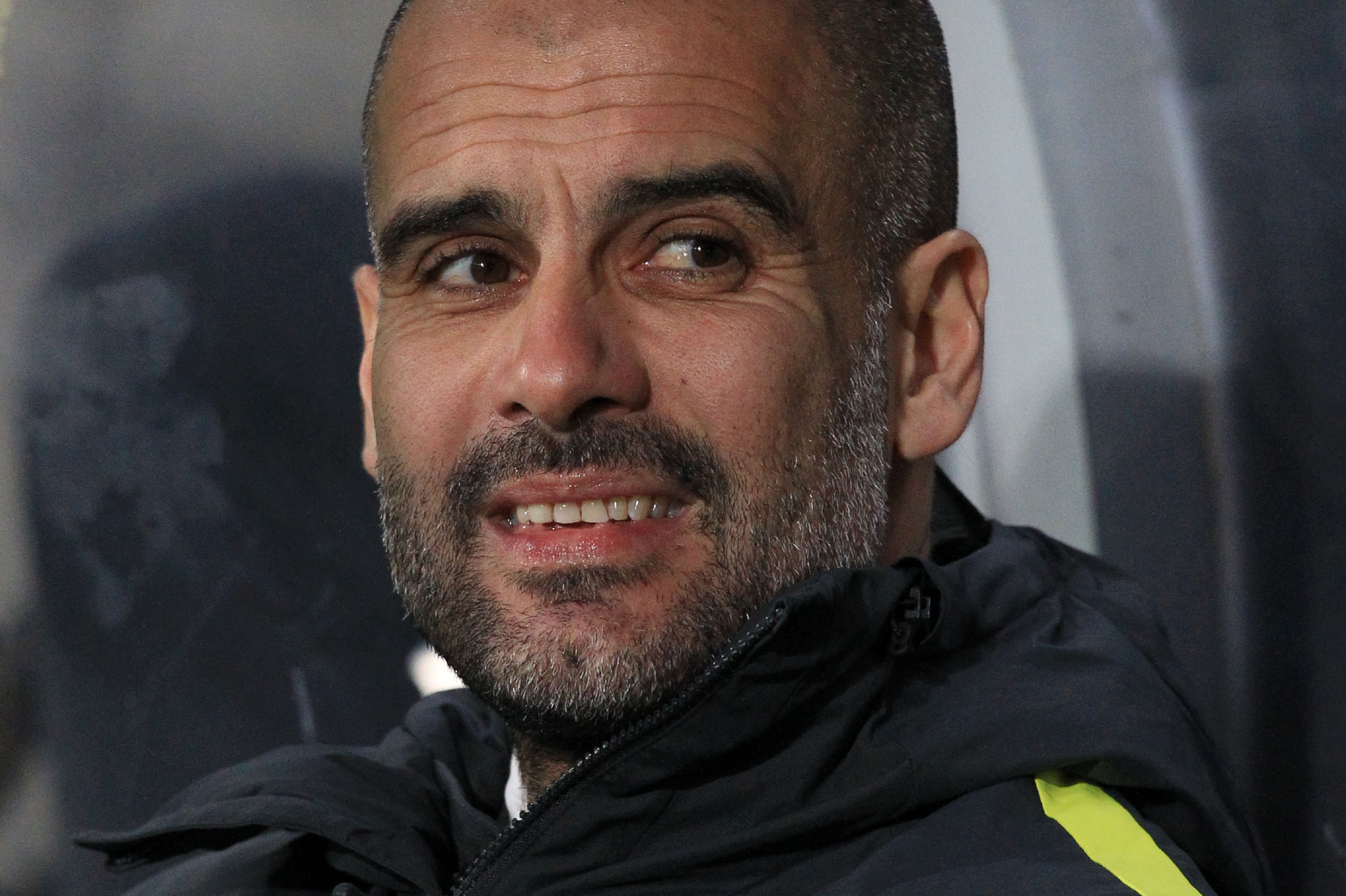 Will Pep Guardiola be smiling on Saturday? (Photo courtesy - Lindsey Parnaby/AFP/Getty Images)