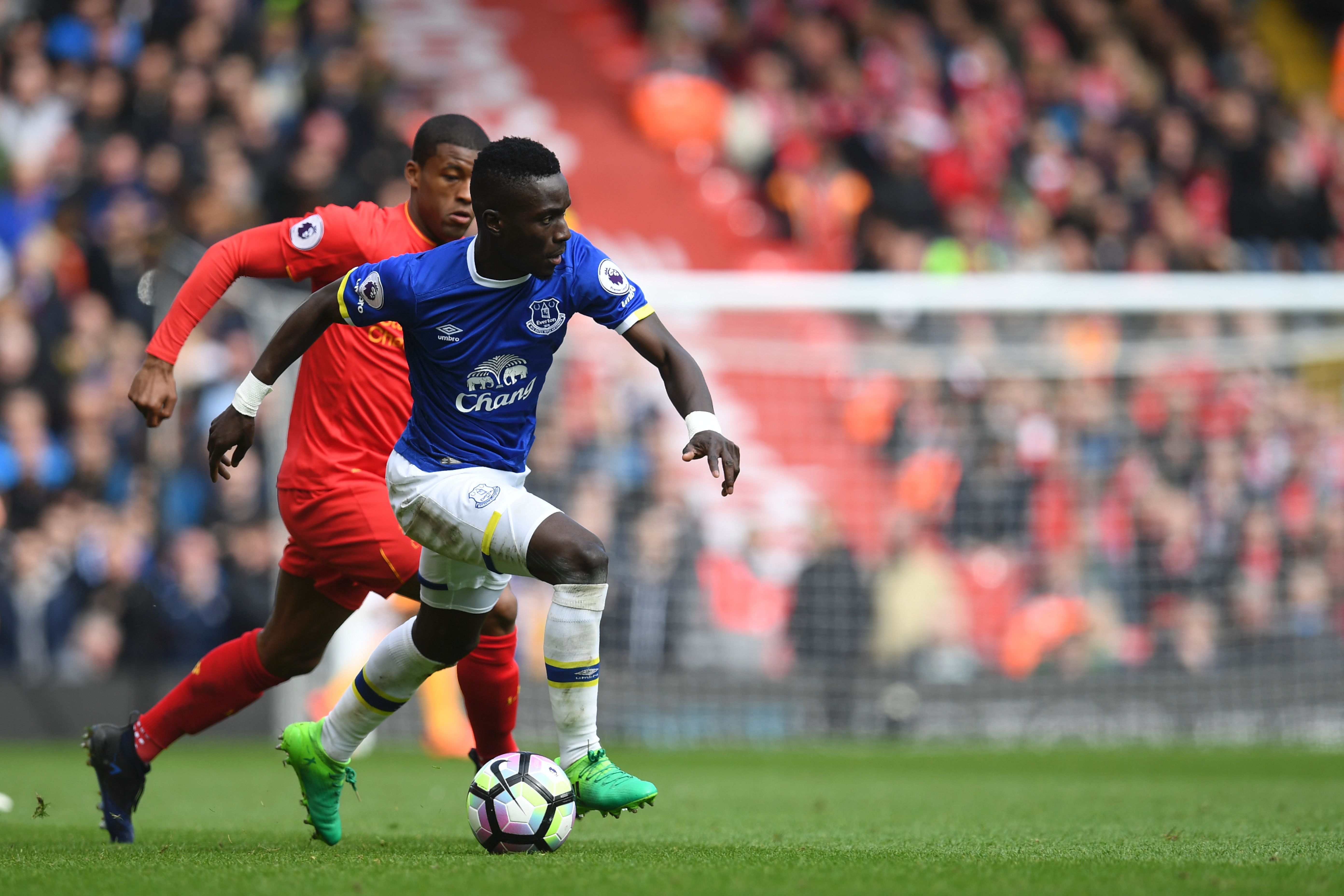 Everton's Senegalese midfielder Idrissa Gueye (R) vies with Liverpool's Dutch midfielder Georginio Wijnaldum during the English Premier League football match between Liverpool and Everton at Anfield in Liverpool, north west England on April 1, 2017. / AFP PHOTO / Paul ELLIS / RESTRICTED TO EDITORIAL USE. No use with unauthorized audio, video, data, fixture lists, club/league logos or 'live' services. Online in-match use limited to 75 images, no video emulation. No use in betting, games or single club/league/player publications.  /         (Photo credit should read PAUL ELLIS/AFP/Getty Images)