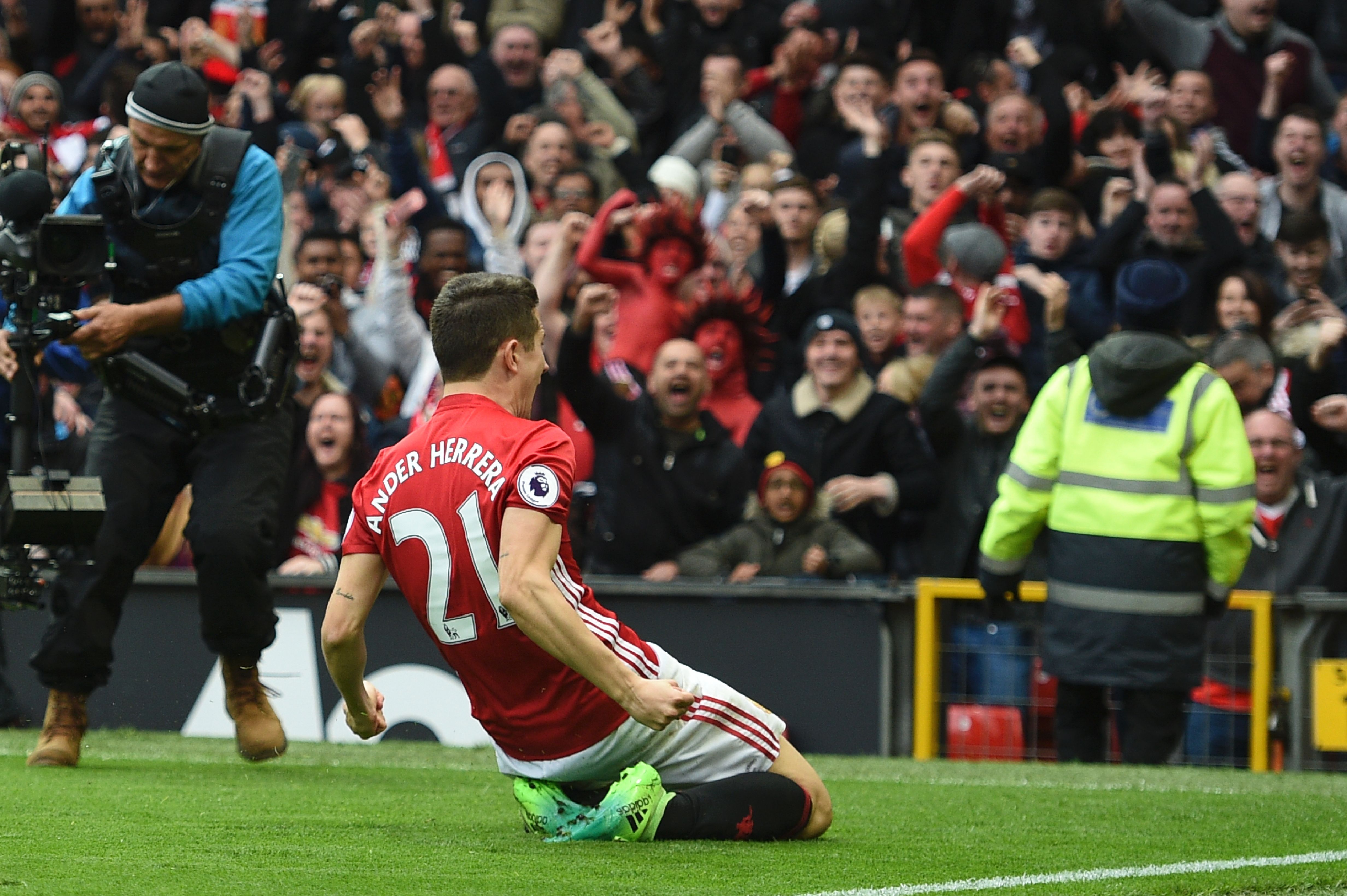 Manchester United's Spanish midfielder Ander Herrera celebrates scoring their second goal during the English Premier League football match between Manchester United and Chelsea at Old Trafford in Manchester, north west England, on April 16, 2017. / AFP PHOTO / Oli SCARFF / RESTRICTED TO EDITORIAL USE. No use with unauthorized audio, video, data, fixture lists, club/league logos or 'live' services. Online in-match use limited to 75 images, no video emulation. No use in betting, games or single club/league/player publications.  /         (Photo credit should read OLI SCARFF/AFP/Getty Images)
