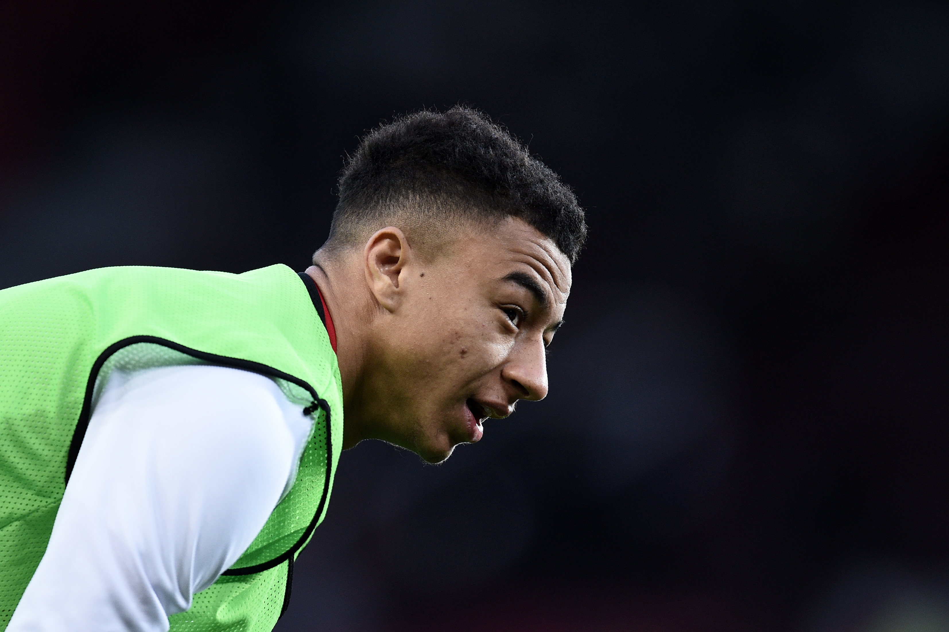 Manchester United's English midfielder Jesse Lingard warms up ahead of the English Premier League football match between Manchester United and Everton at Old Trafford in Manchester, north west England, on April 4, 2017. / AFP PHOTO / Oli SCARFF / RESTRICTED TO EDITORIAL USE. No use with unauthorized audio, video, data, fixture lists, club/league logos or 'live' services. Online in-match use limited to 75 images, no video emulation. No use in betting, games or single club/league/player publications.  /         (Photo credit should read OLI SCARFF/AFP/Getty Images)