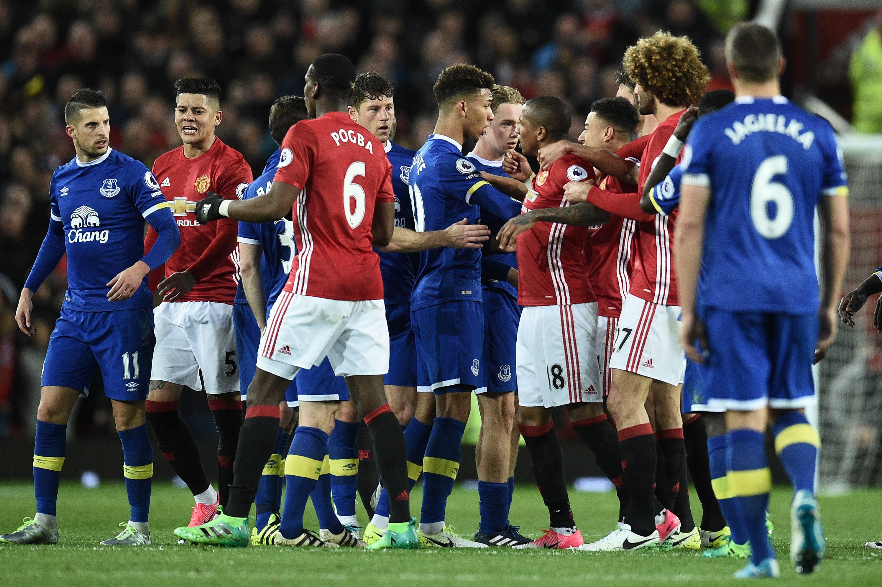 Everton's Belgian striker Kevin Mirallas (L) remonstrates with Manchester United's French midfielder Paul Pogba (3L) as Everton's English defender Mason Holgate (C) remonstrates with Manchester United's English midfielder Ashley Young (4R) during the English Premier League football match between Manchester United and Everton at Old Trafford in Manchester, north west England, on April 4, 2017. / AFP PHOTO / Oli SCARFF / RESTRICTED TO EDITORIAL USE. No use with unauthorized audio, video, data, fixture lists, club/league logos or 'live' services. Online in-match use limited to 75 images, no video emulation. No use in betting, games or single club/league/player publications.  /         (Photo credit should read OLI SCARFF/AFP/Getty Images)