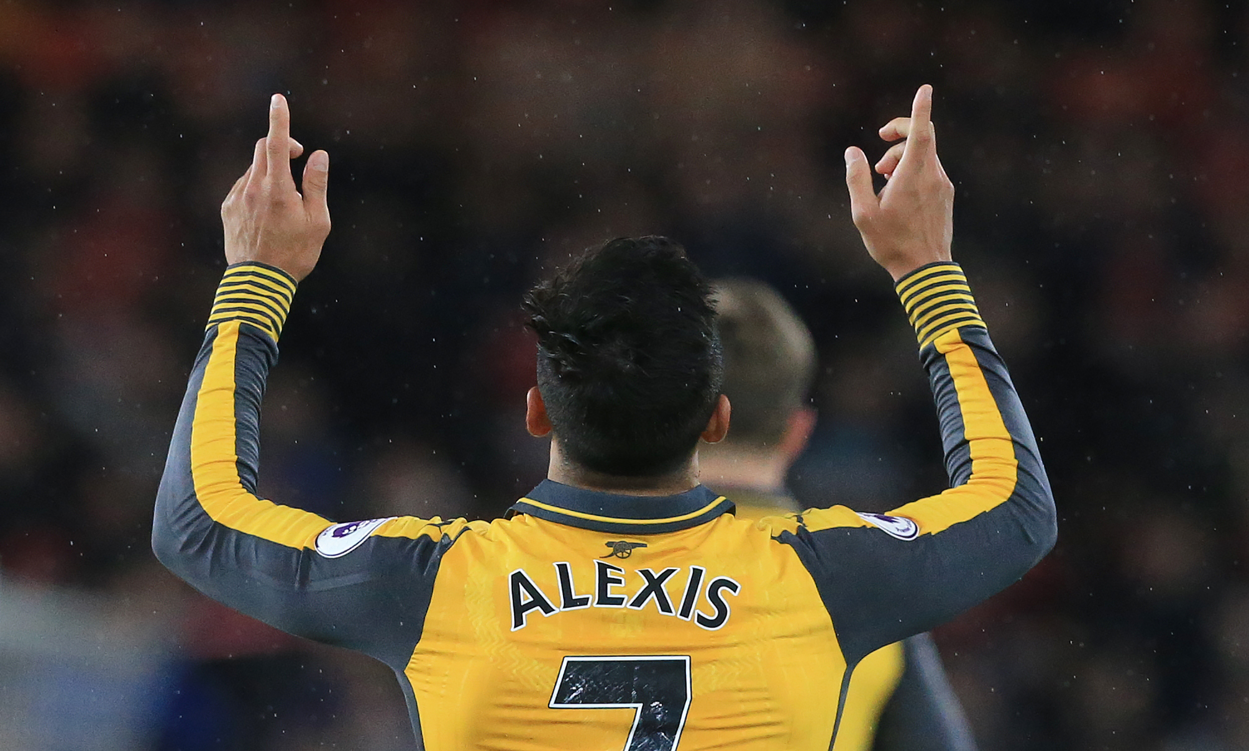 Arsenal's Chilean striker Alexis Sanchez celebrates scoring his team's first goal during the English Premier League football match between Middlesbrough and Arsenal at Riverside Stadium in Middlesbrough, northeast England on April 17, 2017. / AFP PHOTO / Lindsey PARNABY / RESTRICTED TO EDITORIAL USE. No use with unauthorized audio, video, data, fixture lists, club/league logos or 'live' services. Online in-match use limited to 75 images, no video emulation. No use in betting, games or single club/league/player publications.  /         (Photo credit should read LINDSEY PARNABY/AFP/Getty Images)