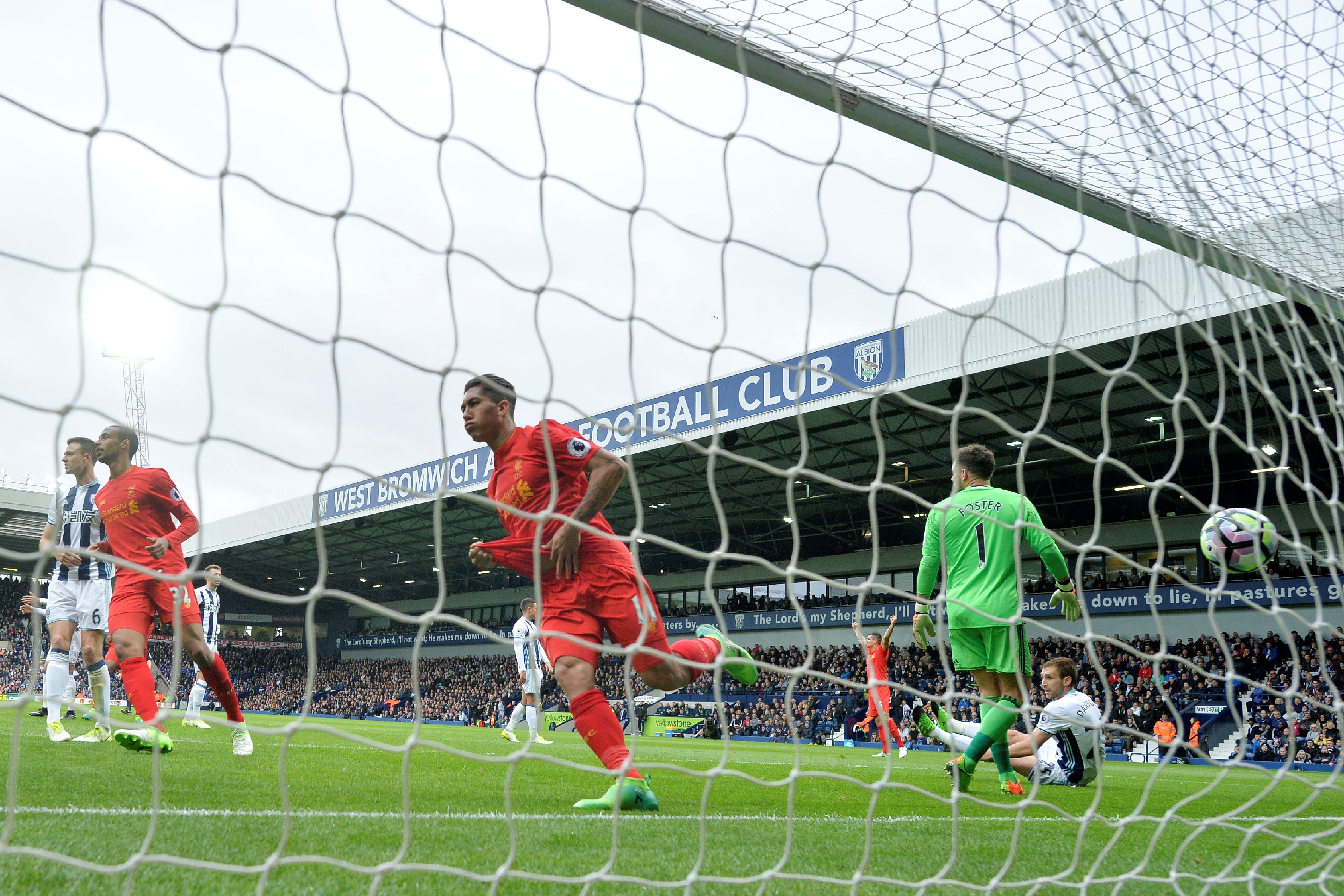 Liverpool's Brazilian midfielder Roberto Firmino (C) celebrates scoring the opening goal past West Bromwich Albion's English goalkeeper Ben Foster (R) during the English Premier League football match between West Bromwich Albion and Liverpool at The Hawthorns stadium in West Bromwich, central England, on April 16, 2017.
 / AFP PHOTO / Justin TALLIS / RESTRICTED TO EDITORIAL USE. No use with unauthorized audio, video, data, fixture lists, club/league logos or 'live' services. Online in-match use limited to 75 images, no video emulation. No use in betting, games or single club/league/player publications.  /         (Photo credit should read JUSTIN TALLIS/AFP/Getty Images)