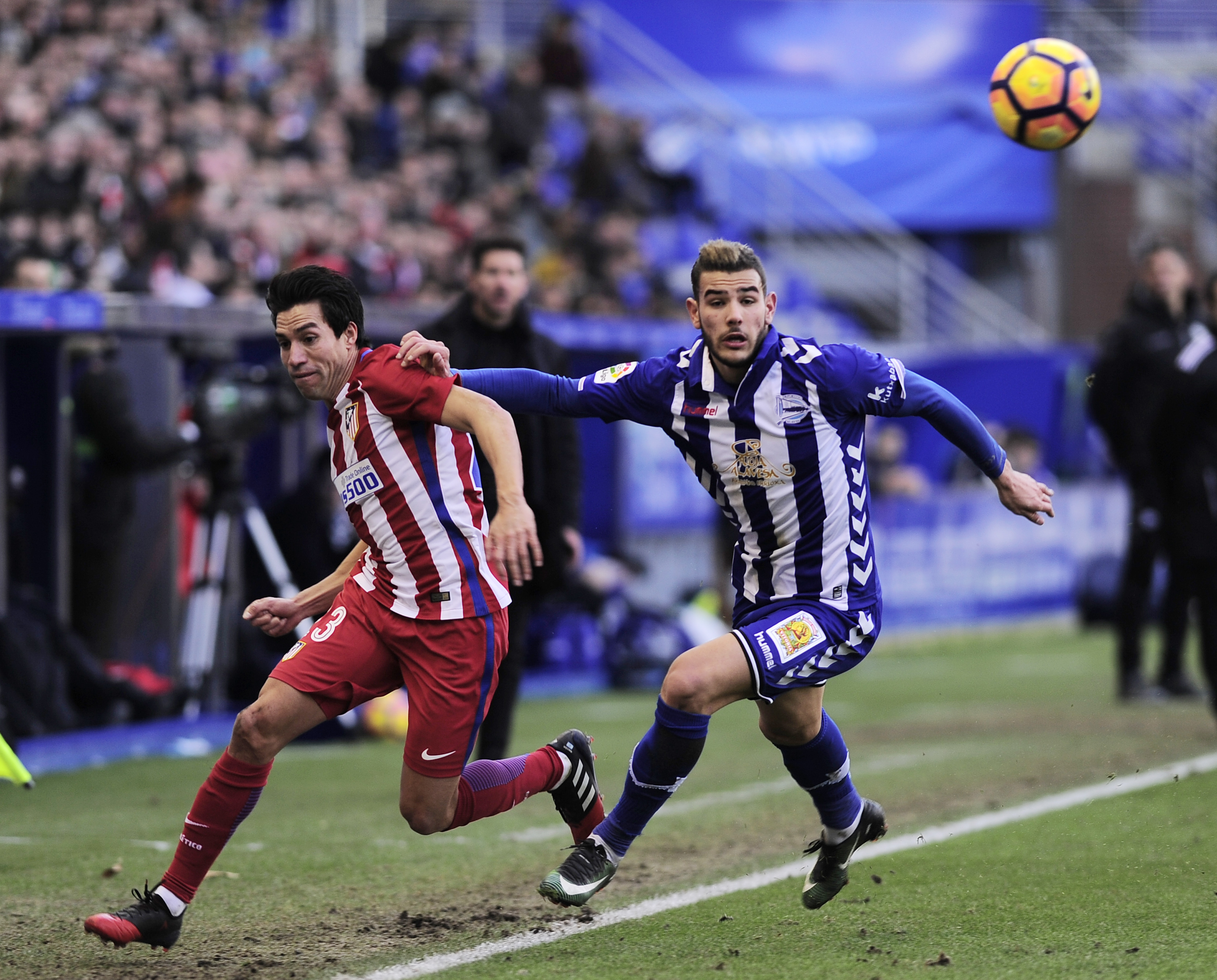 Atletico Madrid's Argentinian midfielder Nicolas Gaitan (L) vies with Deportivo Alaves' French defender Theo Hernandez (R) during the Spanish league football match Club Atletico de Madrid vs Deportivo Alaves at the Mendizorroza stadium in Vitoria on January 28, 2017.
  / AFP PHOTO / ANDER GILLENEA        (Photo credit should read ANDER GILLENEA/AFP/Getty Images)