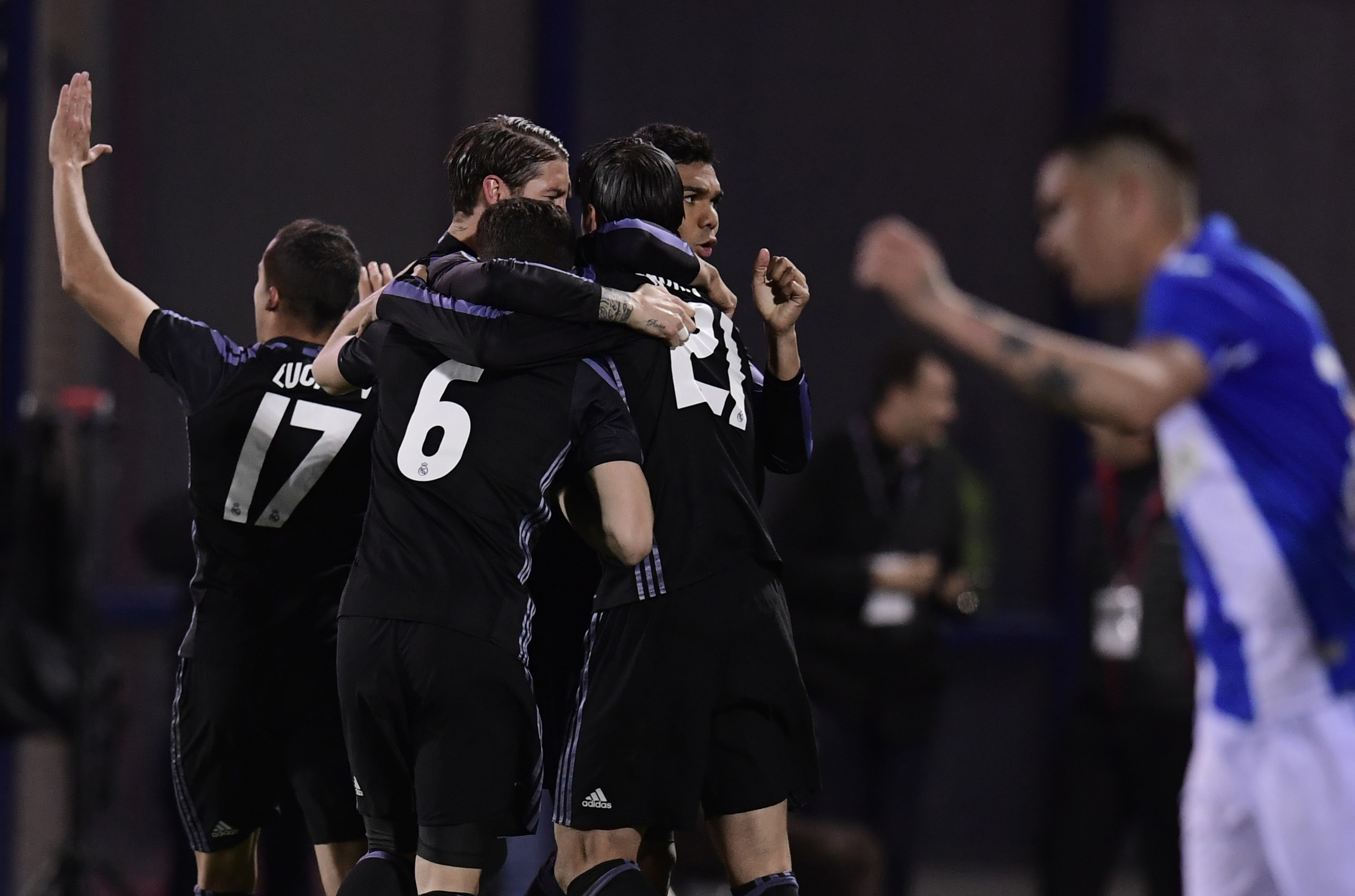Real Madrid players celebrate after scoring their fourth goal during the Spanish league football match Club Deportivo Leganes SAD vs Real Madrid CF at the Estadio Municipal Butarque in Leganes on the outskirts of Madrid on April 5, 2017. / AFP PHOTO / JAVIER SORIANO        (Photo credit should read JAVIER SORIANO/AFP/Getty Images)