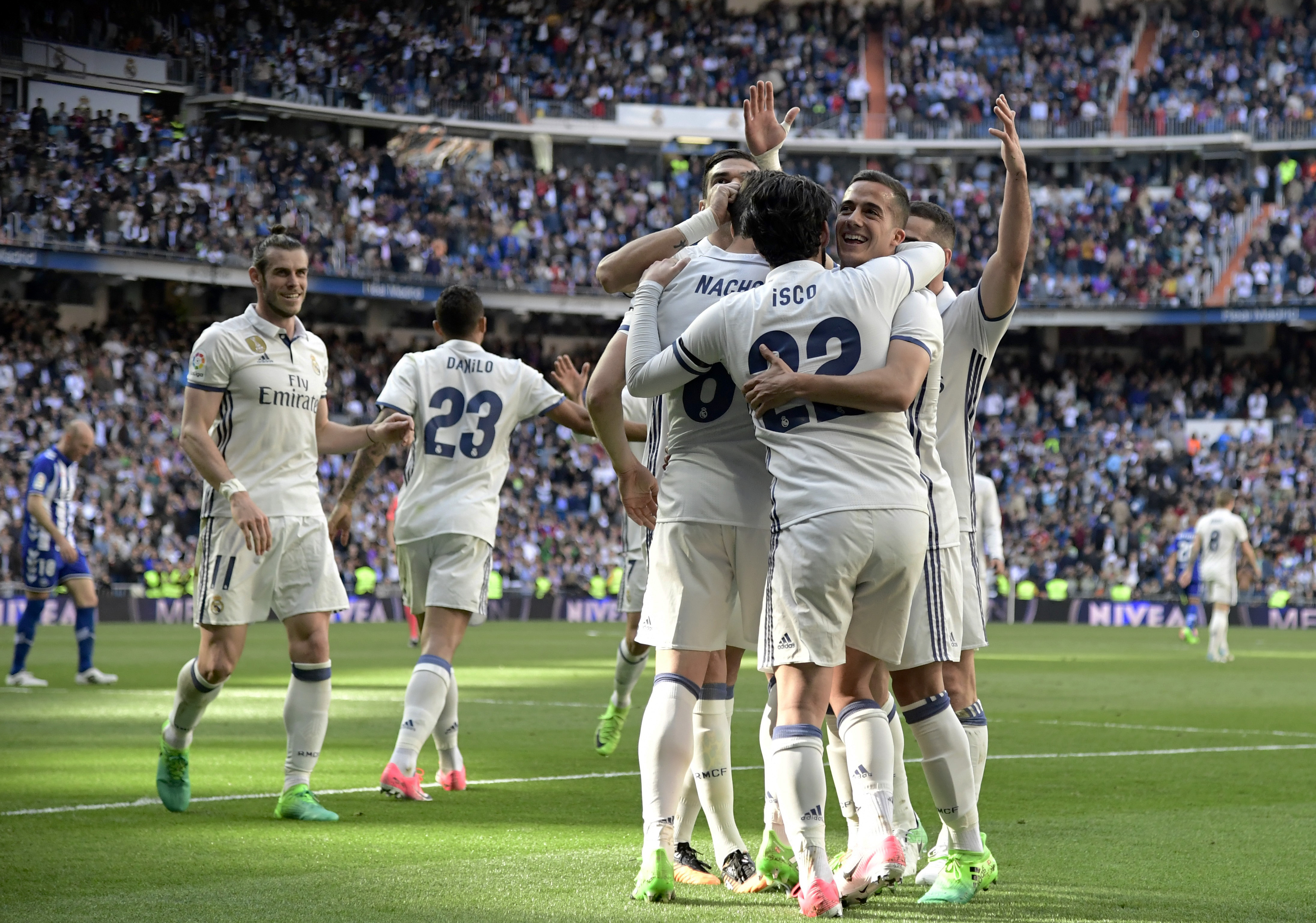 Real Madrid players celebrate a goal during the Spanish league football match Real Madrid CF vs Deportivo Alaves at the Santiago Bernabeu stadium in Madrid on April 2, 2017. / AFP PHOTO / JAVIER SORIANO        (Photo credit should read JAVIER SORIANO/AFP/Getty Images)