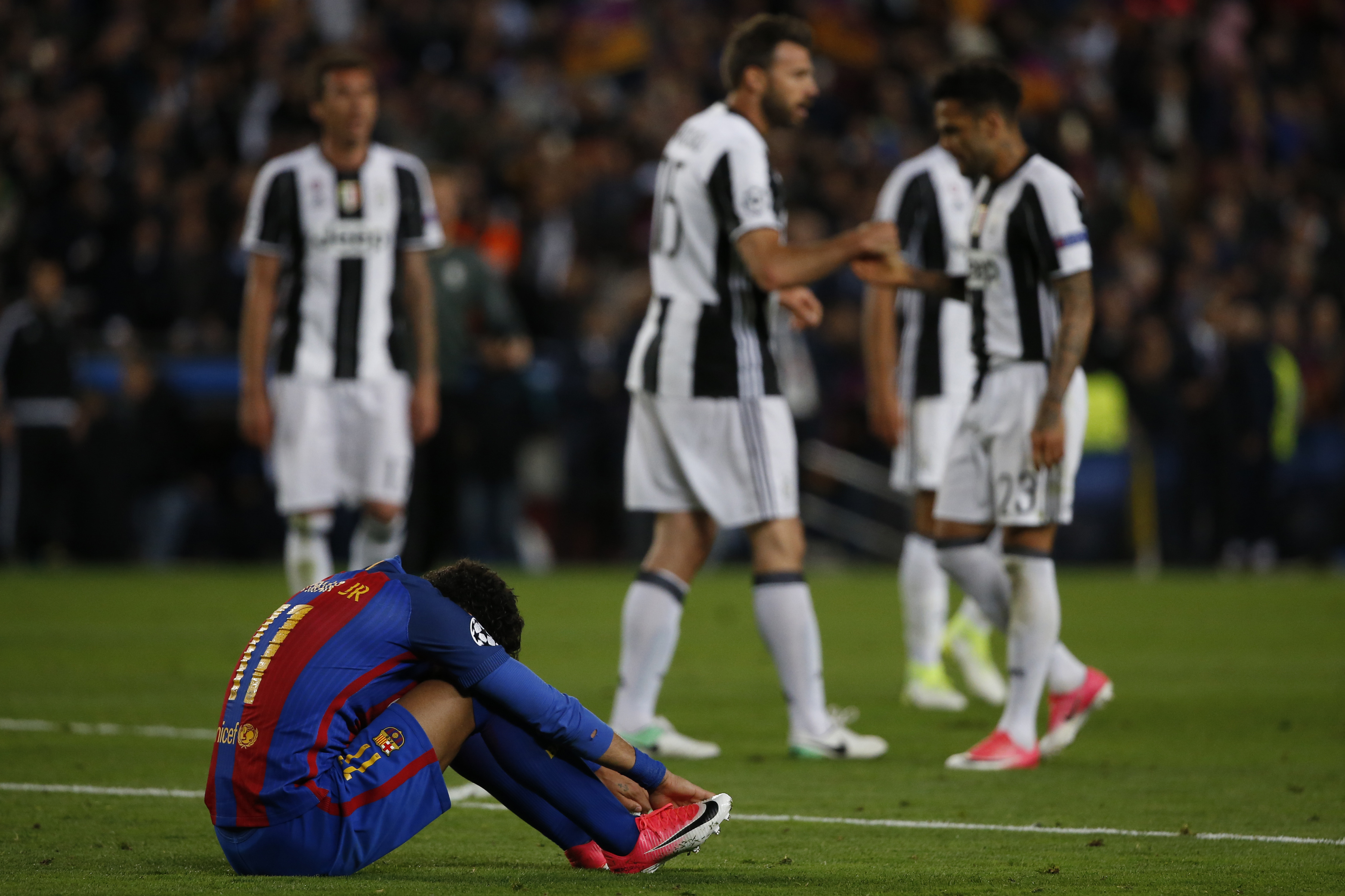 Barcelona's Brazilian forward Neymar sits on the field during the UEFA Champions League quarter-final second leg football match FC Barcelona vs Juventus at the Camp Nou stadium in Barcelona on April 19, 2017. / AFP PHOTO / Marco BERTORELLO        (Photo credit should read MARCO BERTORELLO/AFP/Getty Images)